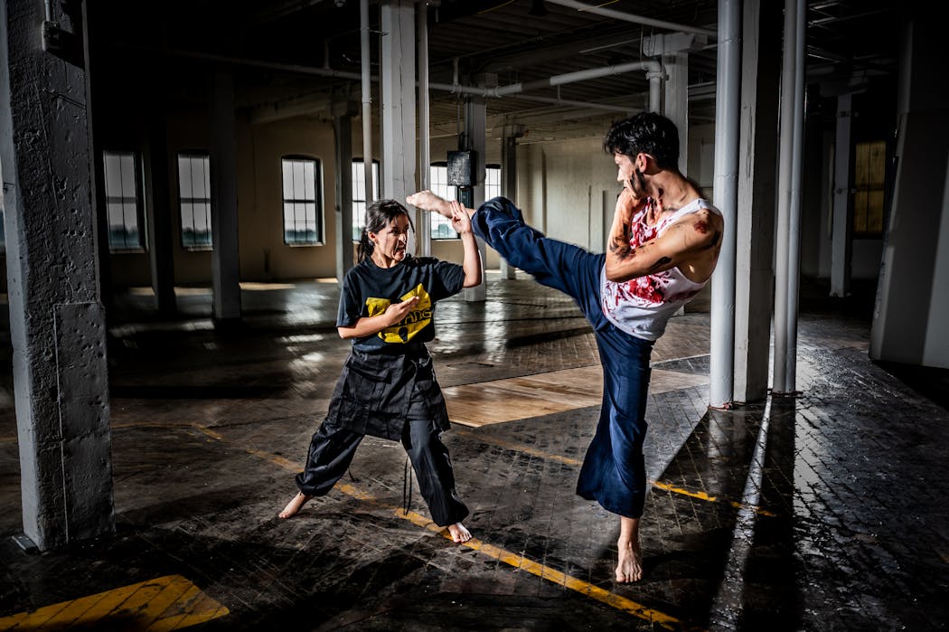Hannah Nguyen’s character Arun blocks a kick from kung fu zombie Kobe Markworth. 