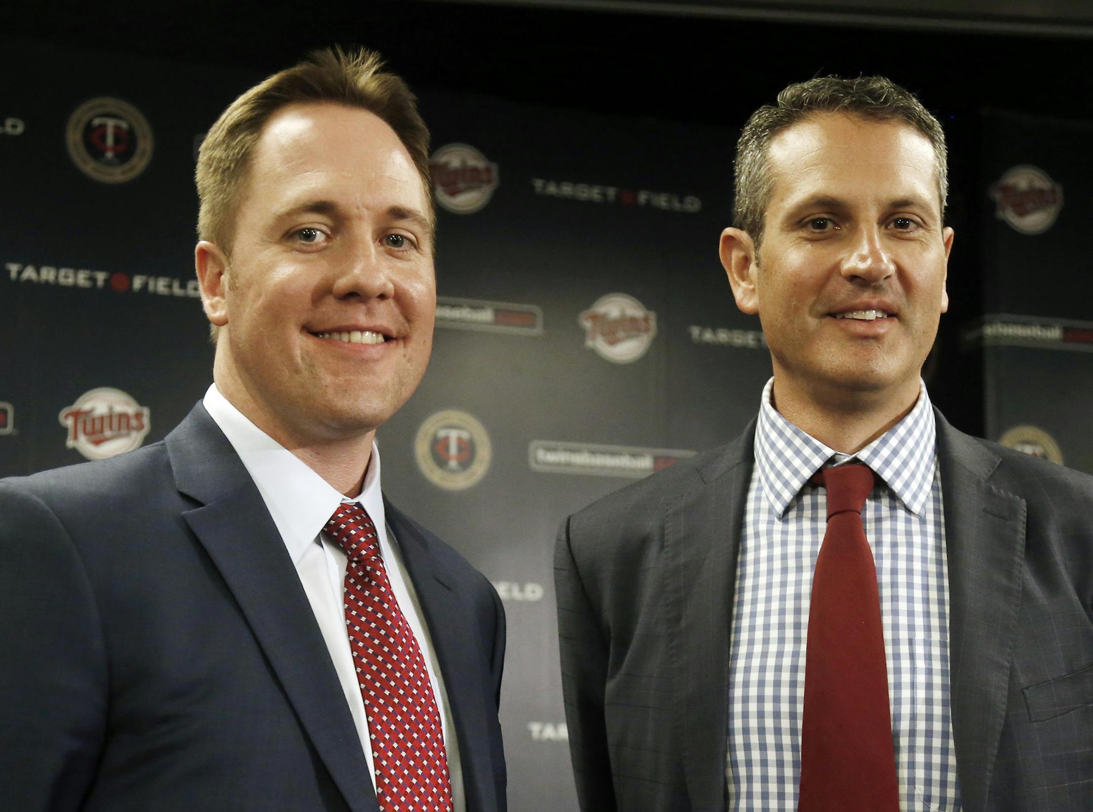 CORRECTS TAD TO THAD - Minnesota Twins new chief baseball officer Derek Falvey, left, and new general manager Thad Levine pose after a news conference introducing them to the media Monday, Nov. 7, 2016 in Minneapolis. (AP Photo/Jim Mone)