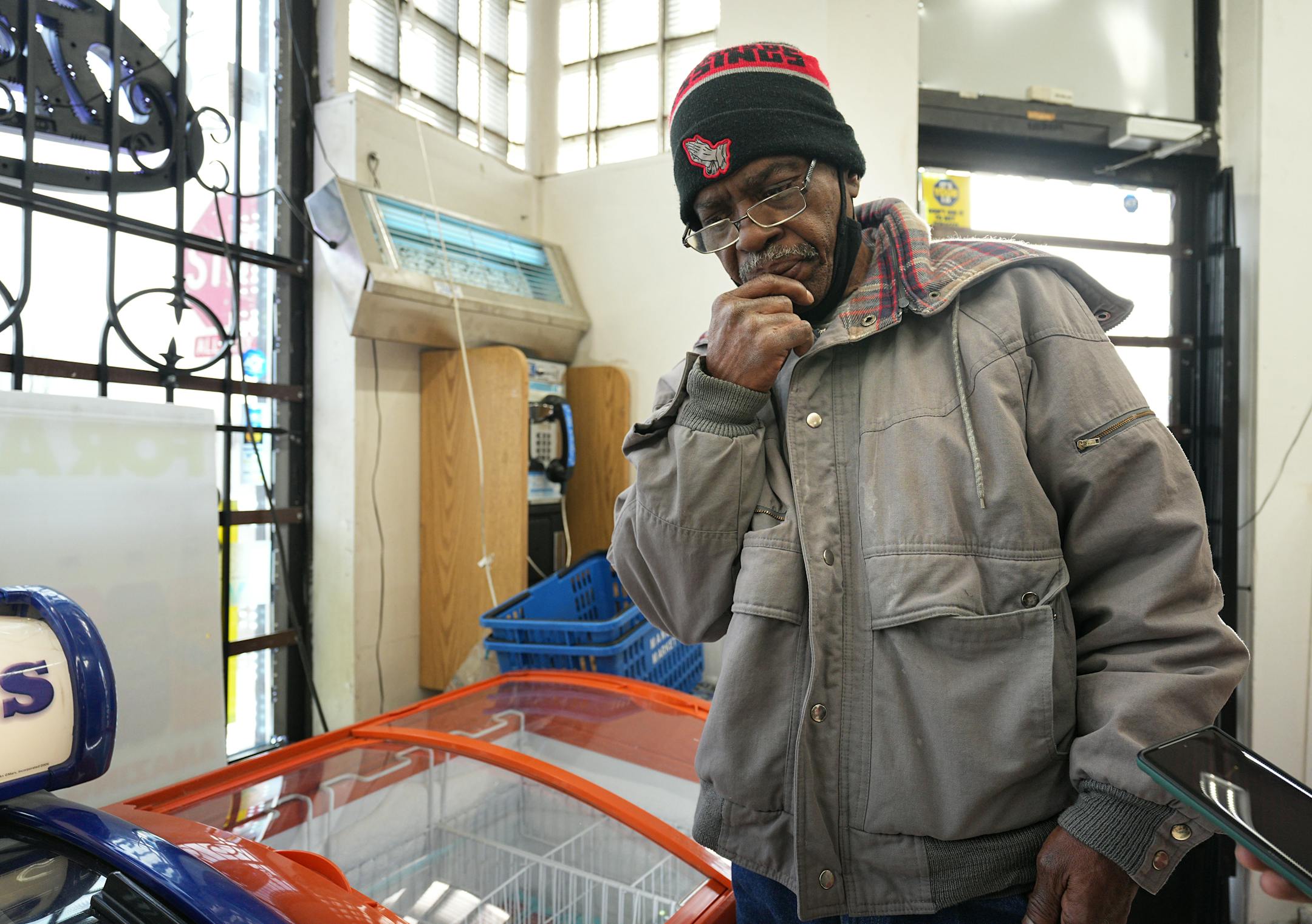 Curtis Collins, who was at the M&A Market near the shooting, tries to ponder what went wrong onTuesday, Dec. 6, 2022 in St. Paul, a day after Howard Johnson was fatally shot by St. Paul Police.