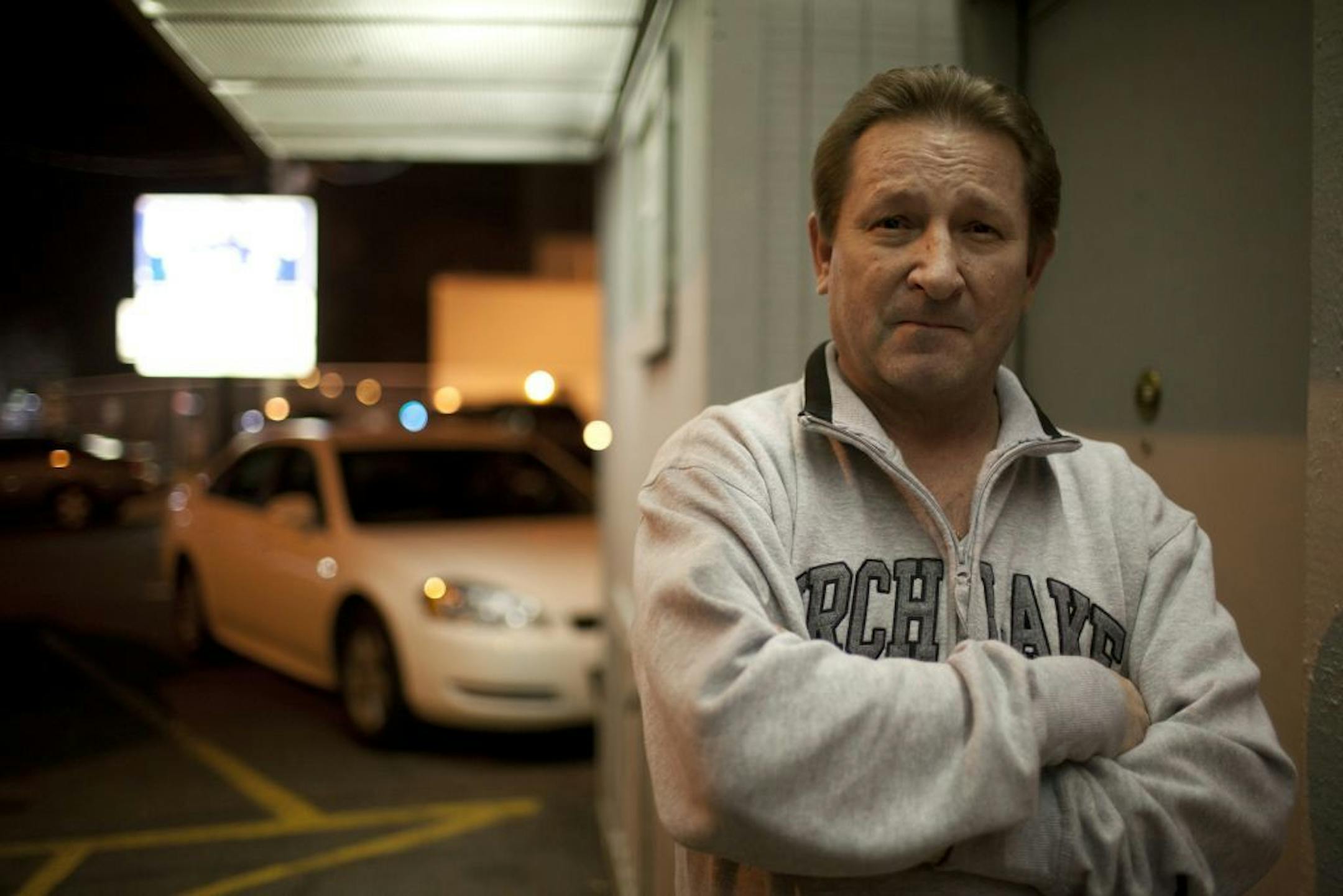 Champions bar in south Minneapolis is a neighborhood mainstay, a rough dive with a band of loyal customers. This week 14 people were arrested on drug charges following an undercover police operation that shed light on the bar's continuing challenges. On Friday, liquor license officials will meet with the bar to discuss the issues. Rick Nelson, owner of Champions, outside his Lake St. bar late Wednesday night, March 21, 2012.