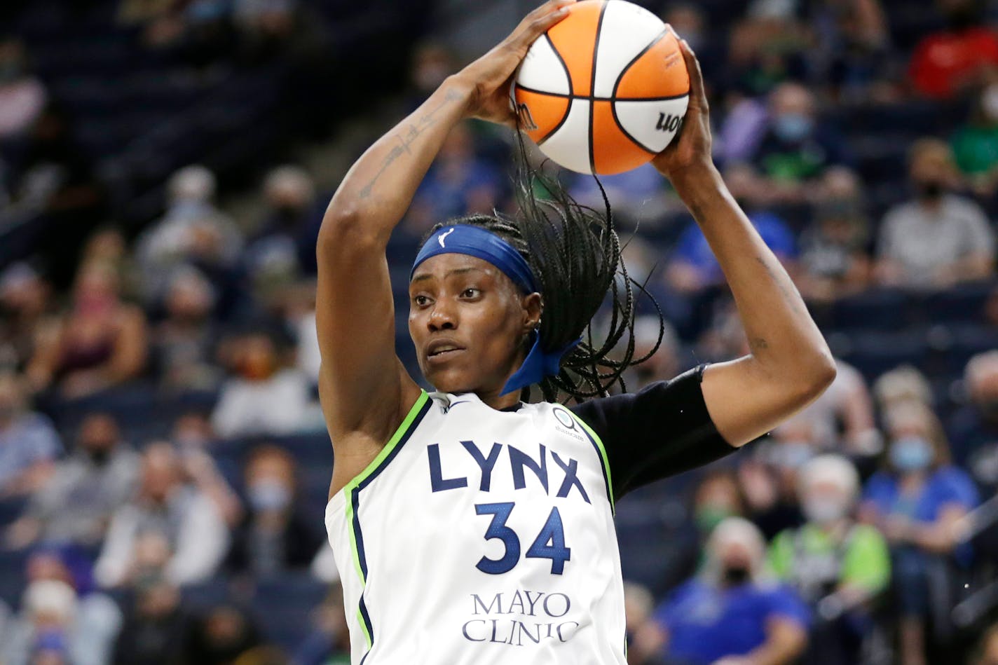 Minnesota Lynx center Sylvia Fowles rebounds during the fourth quarter of the team's WNBA basketball game against the Los Angeles Sparks on Thursday, Sept. 2, 2021, in Minneapolis. (AP Photo/Andy Clayton-King) ORG XMIT: MER900d3ec9e491eaa957b4aaed12d02