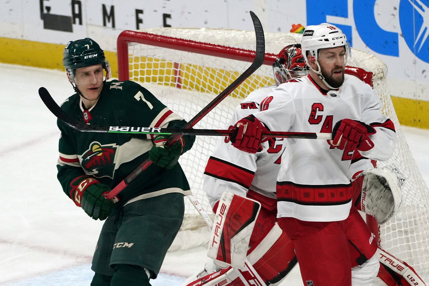 The Wild's Nico Sturm positions himself for a pass as Carolina's Derek Stepan defends in the first period