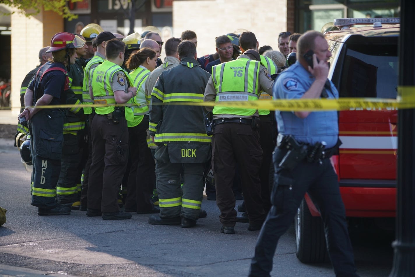 Minneapolis firefighters gathered in Dinkytown on Tuesday before police took over the investigation of the substance in a residential building.