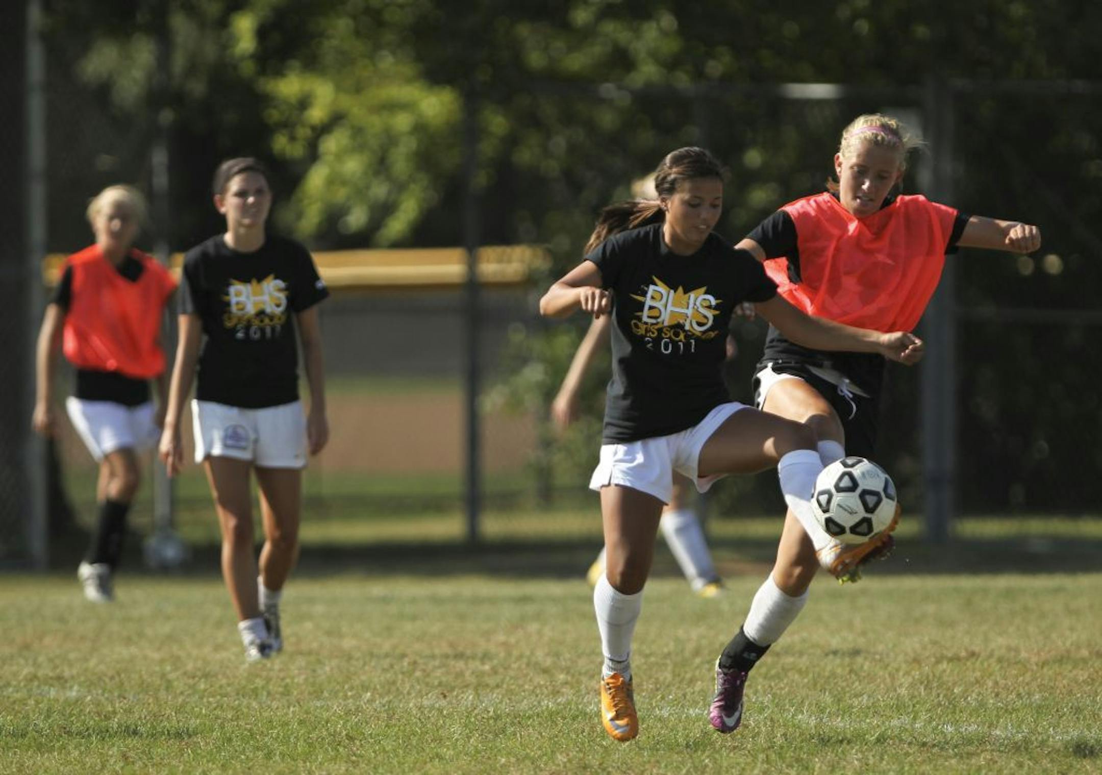 Burnsville's Alyssa Blahnik, left, vied for a the ball with teammate Natalie Muench during a scrimmage Monday afternoon, September 12, 2011. Blahnik is just a sophomore but has already scored ten goals in six games. The team practiced at the school in Burnsville, Minn.