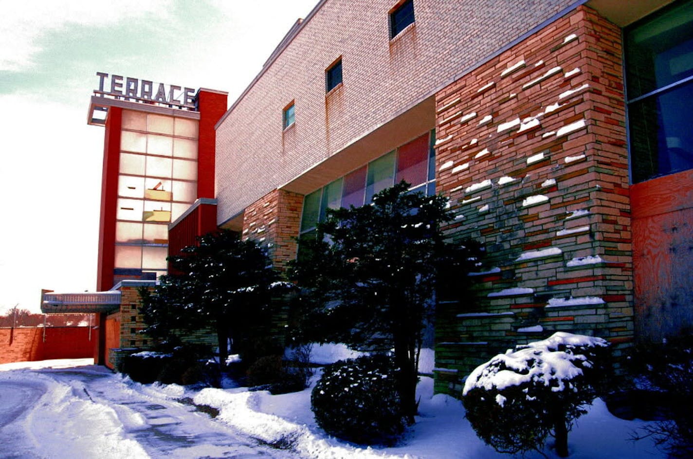 The 1951 Terrace Theatre in Robbinsdale features modern lines, brick columns, slanted lobby windows and a glassy tower.