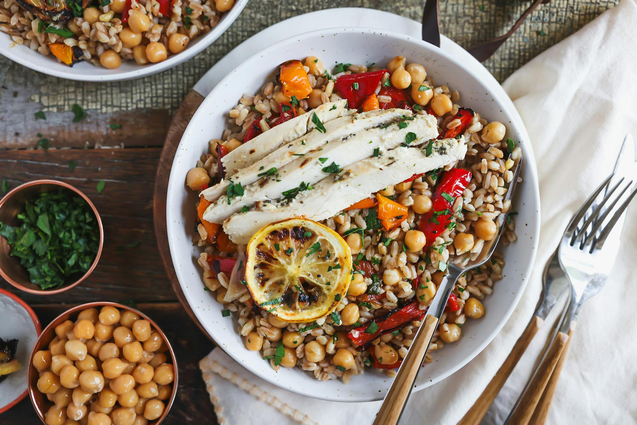 Lemon-Yogurt Chicken is served over farro-chickpea salad for a quick, flavorul meal. Recipe from Beth Dooley, photo by Ashley Moyna Schwickert, Special to the Star Tribune