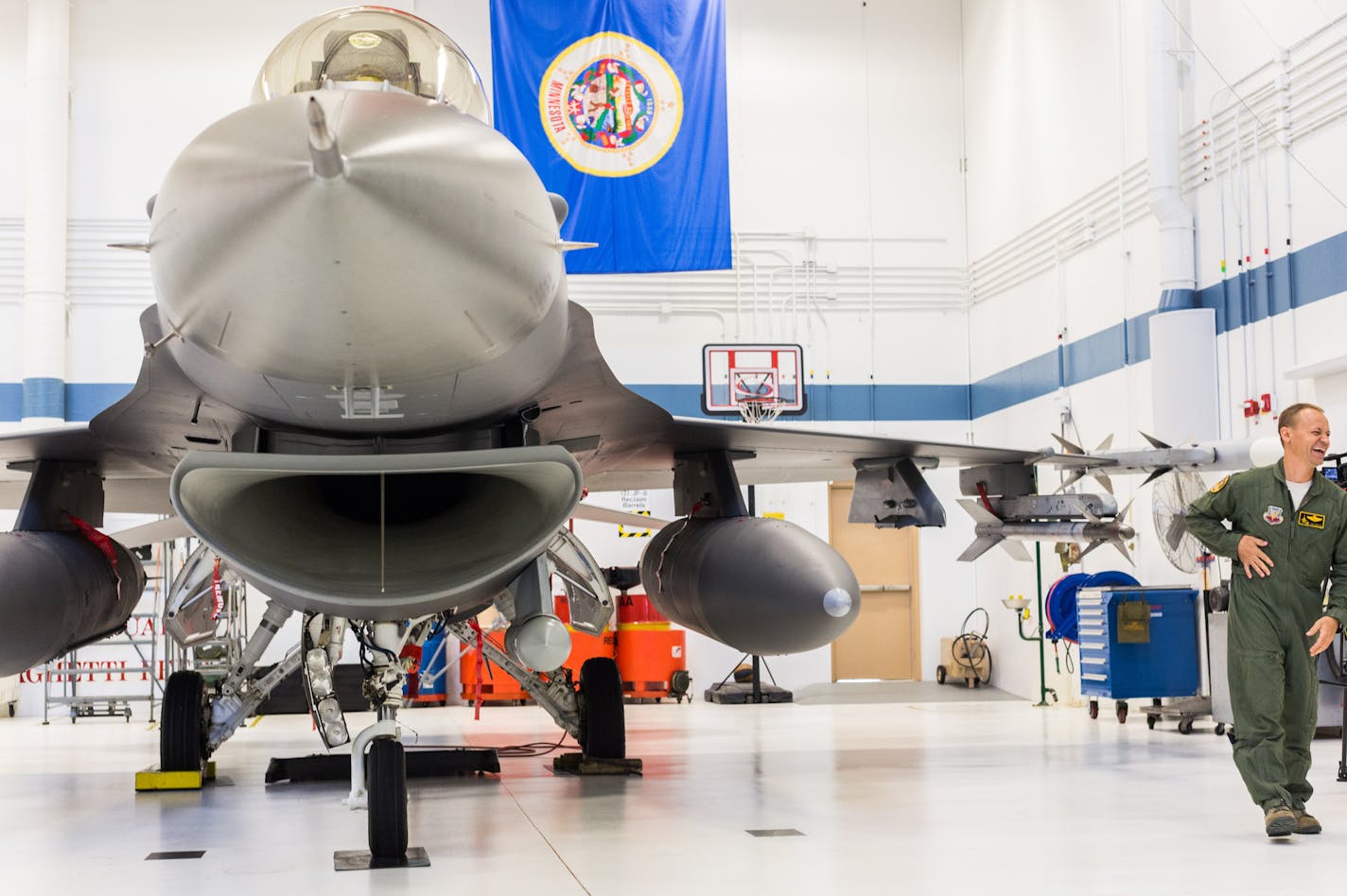 Lt. Col. Curt Grayson stands next to the F-16CM, Block 50, Fighting Falcon, after announcing the Airmen that will be deployed to South Korea. ] Elizabeth Brumley special to the Star Tribune * Airmen of the Duluth-based 148th Fighter Wing hold a press conference about their upcoming deployment to South Korea Elizabeth Brumley special to the Star Tribune * Airmen of the Duluth-based 148th Fighter Wing hold a press conference about their upcoming deployment to South Korea