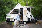 Polly West stands outside her A-frame pop-up camper. The Lyte Hearts chapter of the national group RVing Women camped together at William O'Brien Stat