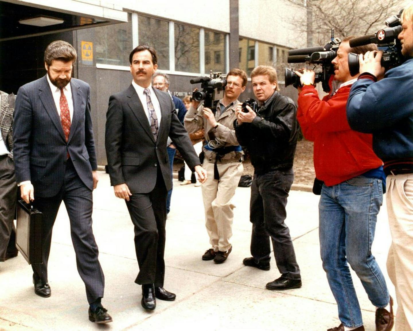 March 29, 1990 Photo of Attorney Bruce Hanley and his client Joseph Balzer (Northwest pilot) leaving the Federal Courthouse after Balzer's court appearance. April 2,1990 Regene Radniecki, Minneapolis Star Tribune