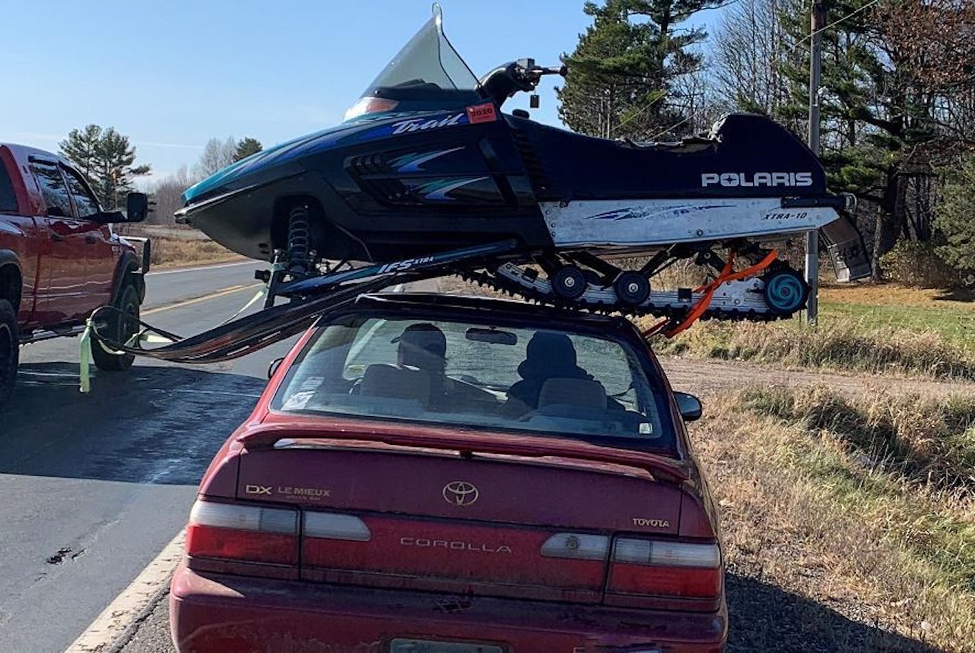 A state trooper in Wisconsin had little trouble deciding whether this car -- and snowmobile -- needed to be pulled over. Credit: Wisconsin Department of Transportation