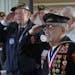 Eighty-four-year-old Manuel Aguirre, of St. Paul, saluted with other World War II veterans during a Pearl Harbor Remembrance Day ceremony Monday in St