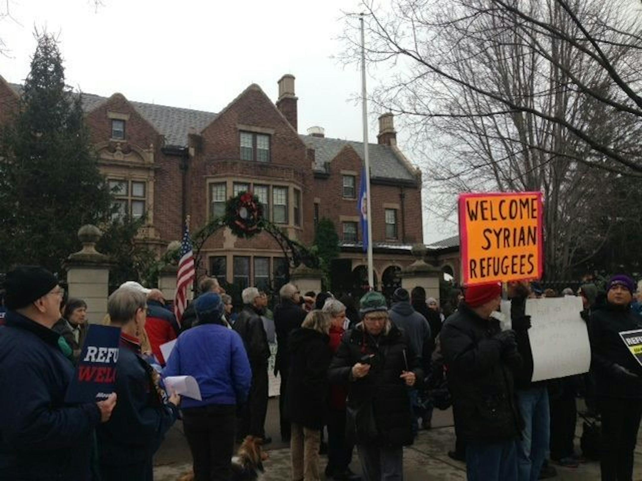 About 100 people rallied Sunday, Dec. 6, at the governor's residence in St. Paul to support leaving the state open to Syrian refugees seeking asylum in the U.S.