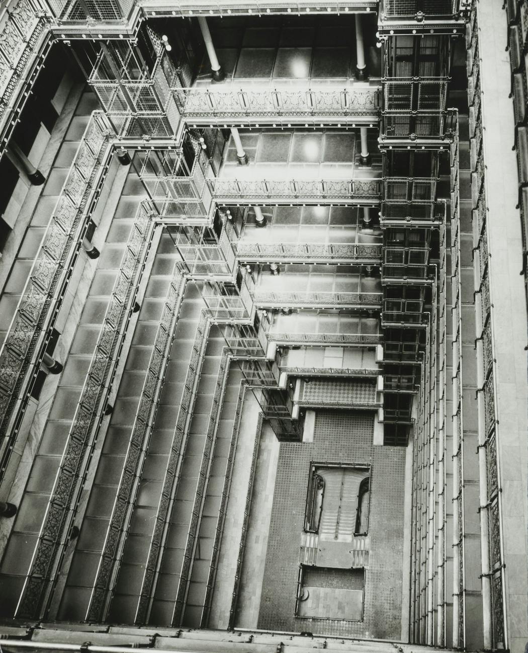 Looking down to the bottom of the Metropolitan Building’s light court, 1961. Many of the galleries surrounding the court featured floors consisting of 1-inch-thick panels of translucent glass.