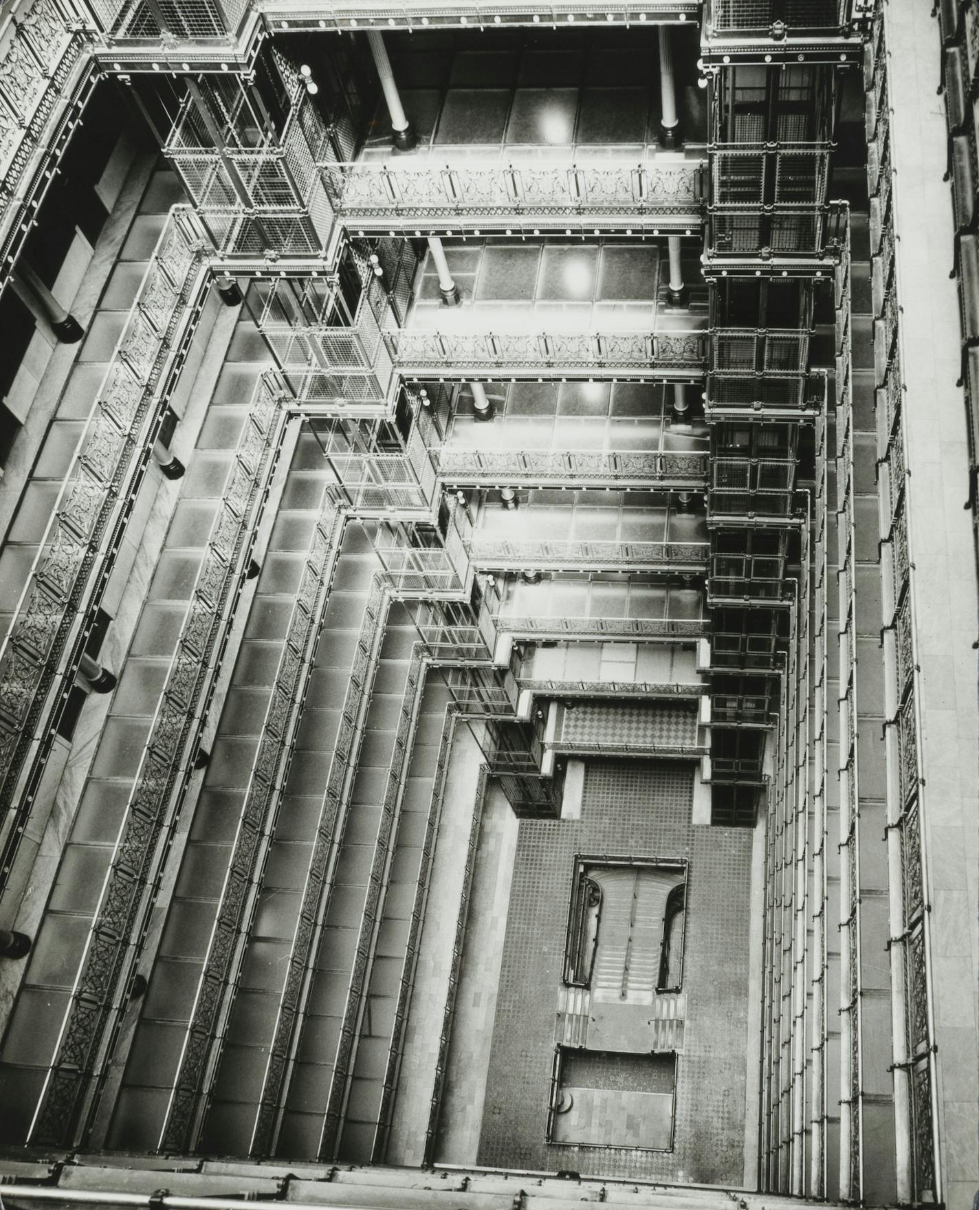 Looking down to the bottom of the Metropolitan Building's light court, 1961. Many of the galleries surrounding the court featured floors consisting of 1-inch-thick panels of translucent glass.