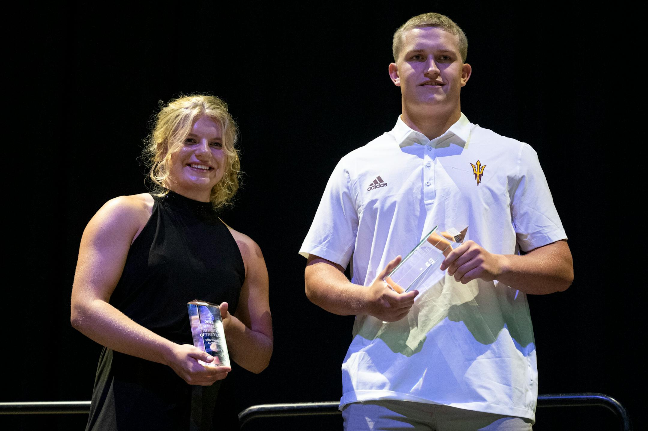 Star Tribune female athlete of the year Ella Pagel and male athlete of the year Hayden Bills stand for a photo with their awards during the Star Tribune's sixth annual All-Metro Sports Awards show.
