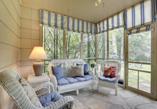 A screened porch faces the backyard.