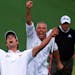 Adam Scott and his caddie, Steve Williams, reacted to Scott's birdie putt dropping on the second playoff hole, after Angel Cabrera, back, had missed h