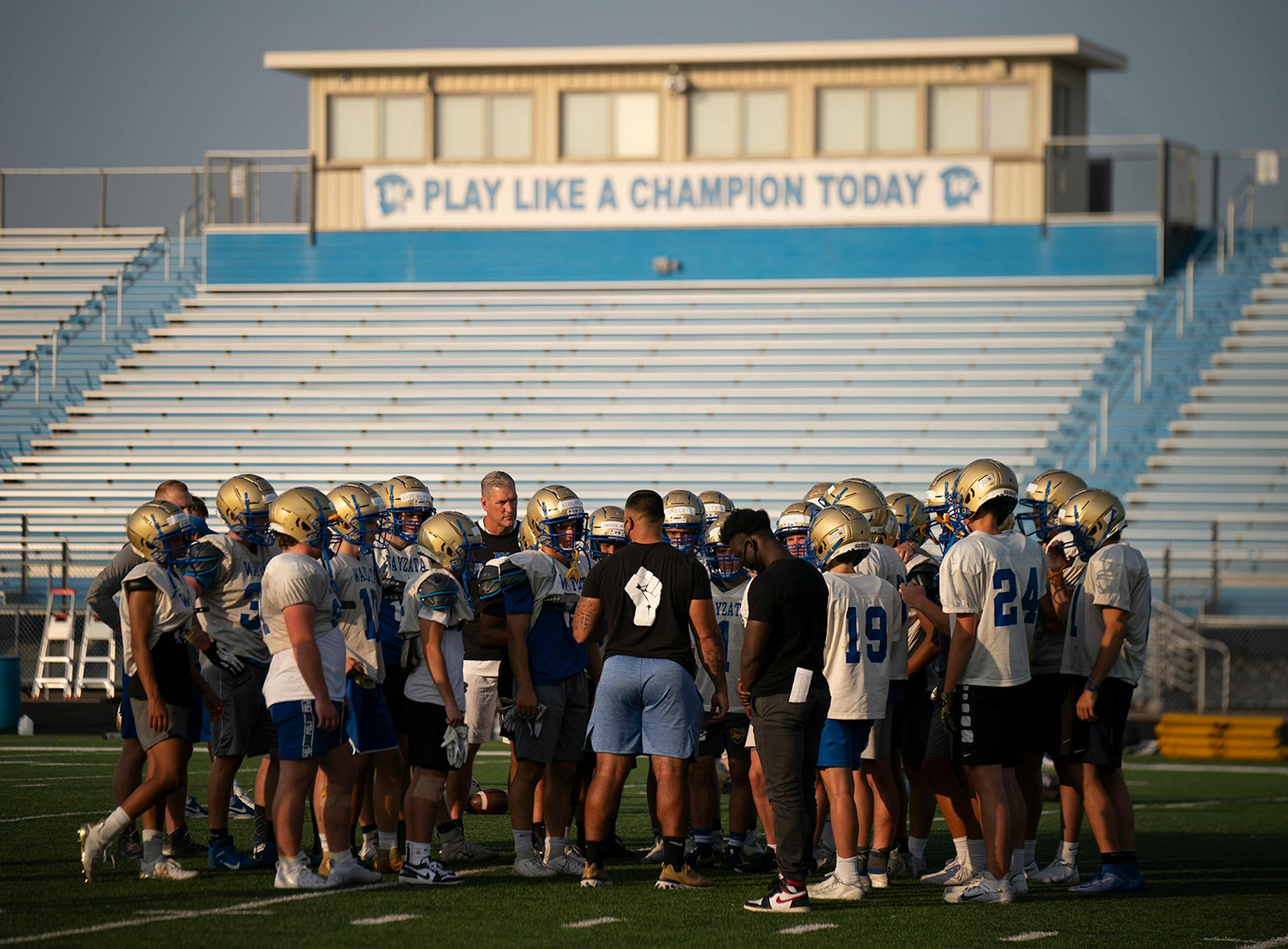 A pod of Wayzata football players gathered for a meeting after practice Monday.