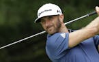 FILE- In this July 3, 2016, file photo, Dustin Johnson tees off on the second hole during the final round of the Bridgestone Invitational golf tournam