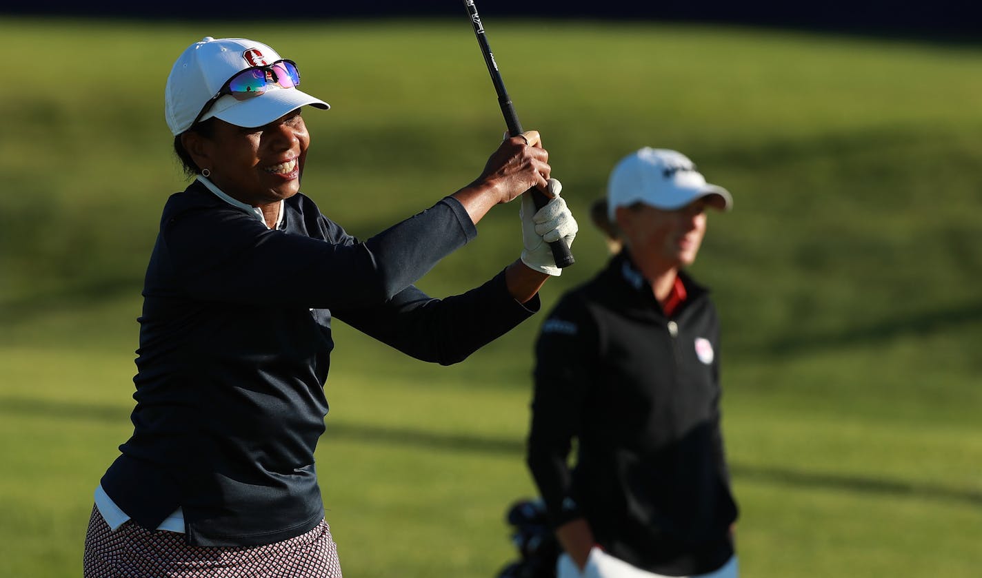 Former Secretary of State Condoleezza Rice golfs with professional golfer Stacy Lewis before the KPMG Women's Leadership Summit Wednesday in connection with the women's golf championship at Hazeltine National. (Provided photo)