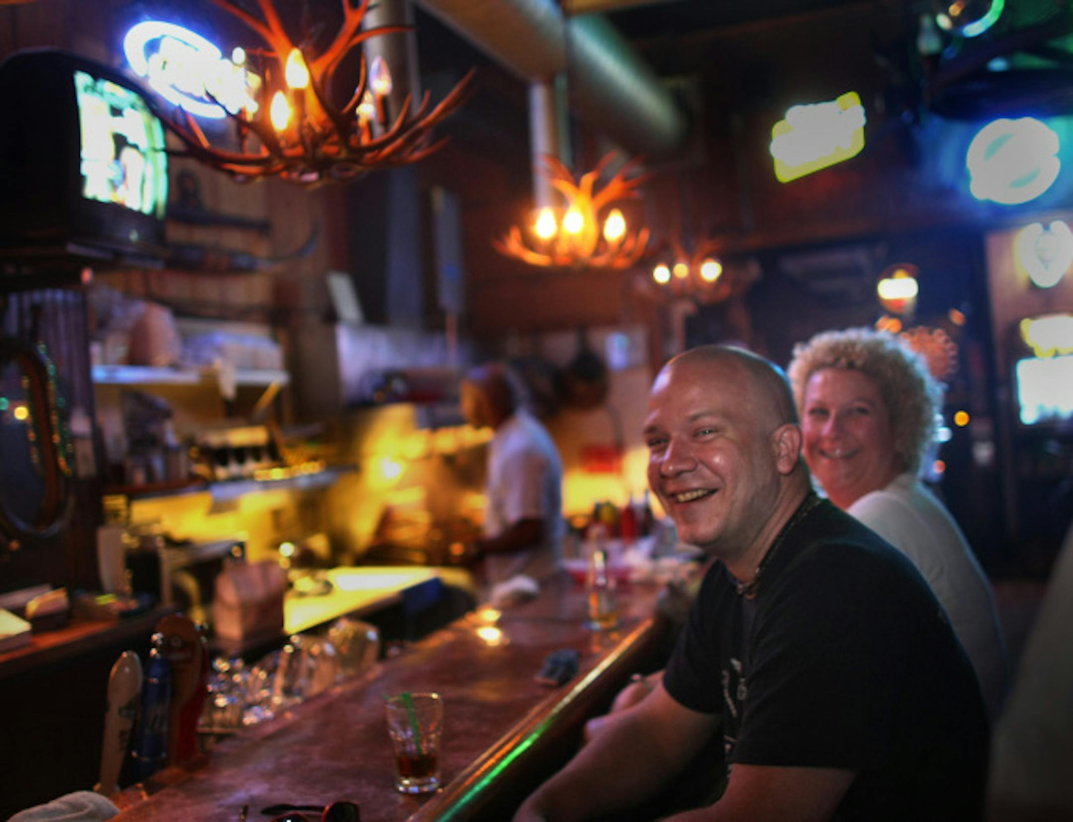 TOM WALLACE � twallace@startribune.comAssign: 00004132C slug: Vitadives0814 Aug 4, 2008Need an example of the twin city Dive Bars, bar? They have good stiff drinks and regulars that make them home for some, they are: The CC Club, 28th and Lyndale South, Palmers, Cedar and Riverside, The Country Bar, Lake and Lyndale,and Big V�s Saloon on Universty in St Paul. [At the Country Bar and Grill, Stu Jacobson sits next to cricket at the bar Thursday night.