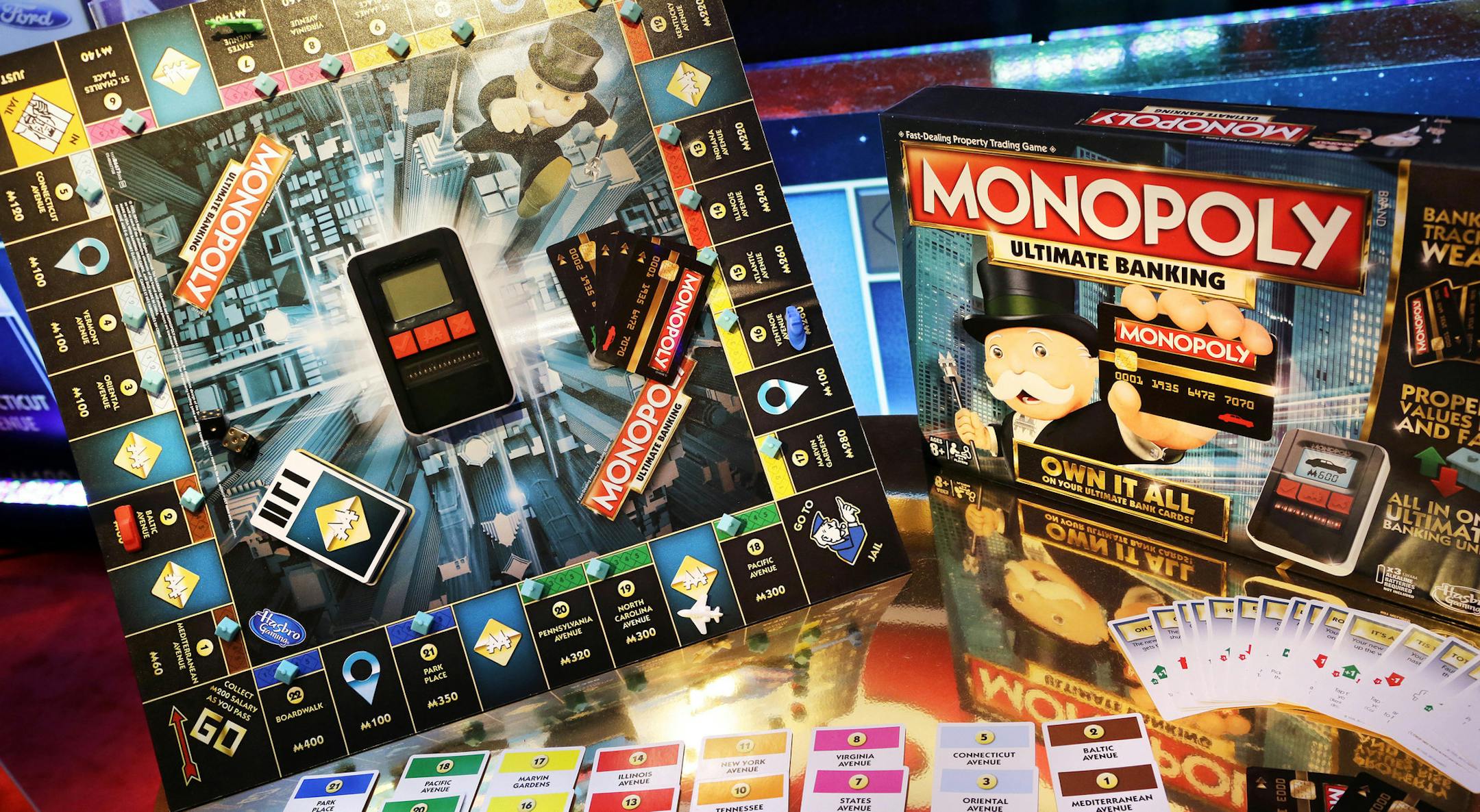 FILE - In this Monday, Feb. 15, 2016, file photo, Monopoly Ultimate Banking Game from Hasbro is displayed at Toy Fair in New York. Hasbro reported earnings, Monday, April 24, 2017, and its revenue surpassed that of its rival Mattel for the first time in 17 years. (AP Photo/Mark Lennihan, File)