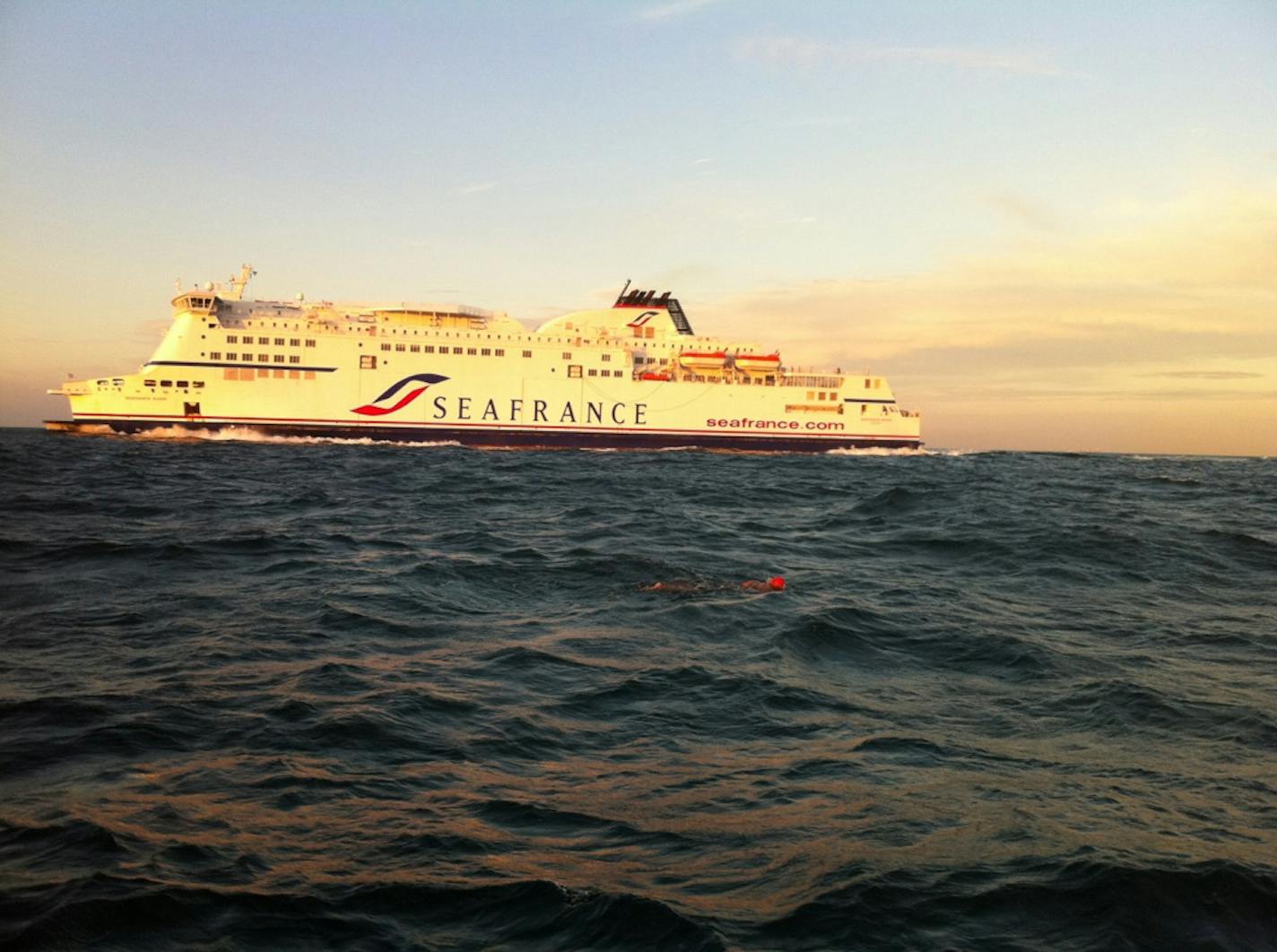 The red speck is swimmer Doug McConnell's cap as he swims the English Channel. The 53-year-old investment banker swam the Channel in 14 hours, 18 minutes, raising $120,000 for ALS research. Medtronic donated $50,000 towards McConnell's goal.