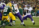 Minnesota Vikings' Adrian Peterson runs during the second half an NFL football game against the Green Bay Packers Sunday, Jan. 3, 2016, in Green Bay, 