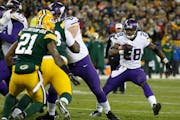 Minnesota Vikings' Adrian Peterson runs during the second half an NFL football game against the Green Bay Packers Sunday, Jan. 3, 2016, in Green Bay, 