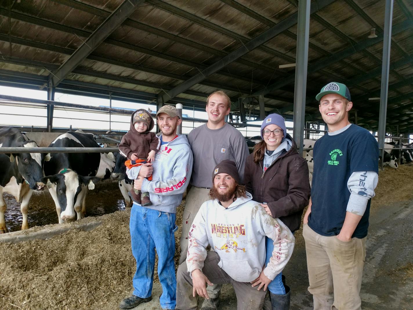 The MPCA provided an estimate of greenhouse gas emissions for an expansion of a dairy farm near Winona owned by the Daley family. The family's sixth generation, pictured here in a 2018 photo, that is rising to run the operation includes: Dustin DePestel holding his son Jasper, Dominick DePestel, Sidney Greden and Gabe Daley. Kneeling: Dylan DePestel.