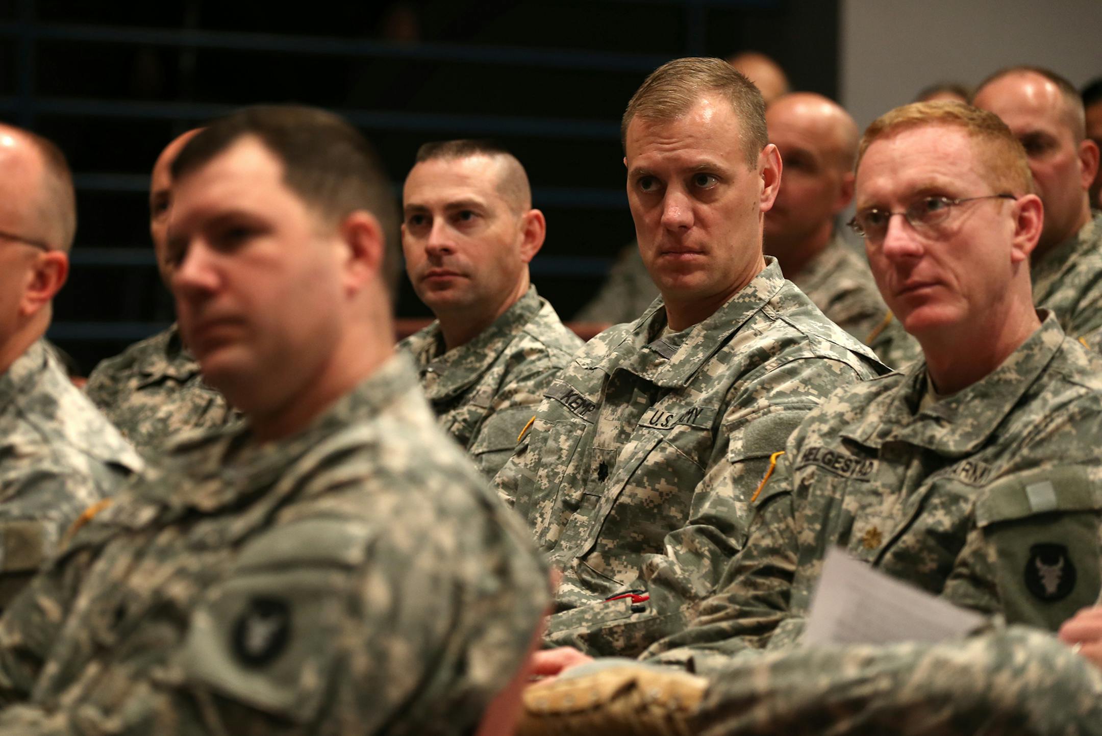 Minnesota National Guard soldiers from the Rosemount-based 34th Red Bull Infantry Division who will be mobilized to support humanitarian relief in Liberia in Spring 2015 attend a press conference at Rosemount National Guard Armory on Monday, November 17, 2014. ] LEILA NAVIDI leila.navidi@startribune.com /