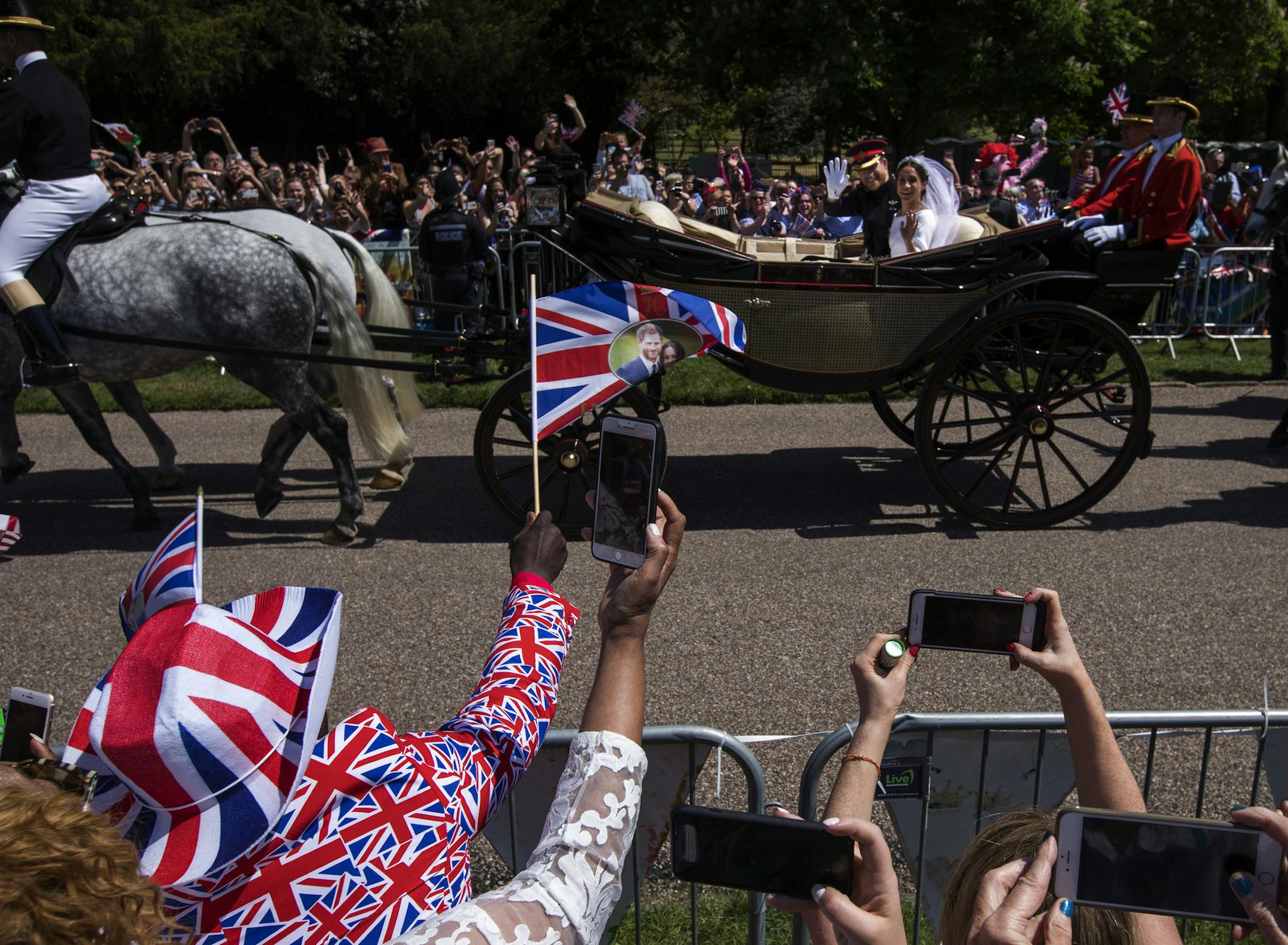Britain's Prince Harry and Meghan Markle greeted the crowd as the Duke and Duchess of Sussex after their wedding ceremony at St. George's Chapel.
