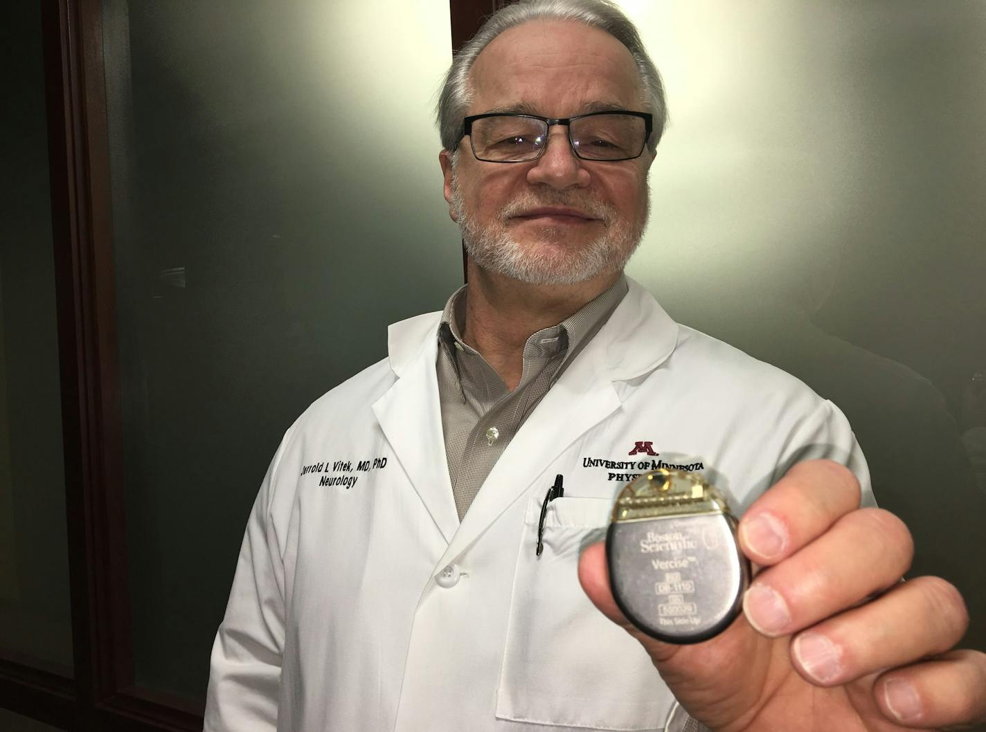 University of Minnesota Neurology Department Head Dr. Jerrold Vitek holds the pulse generator for a Boston Scientific Vercise Deep Brain Stimulation System. Last week Vitek implanted the first Vercise system in the nation, following its commercial approval by regulators earlier this month.