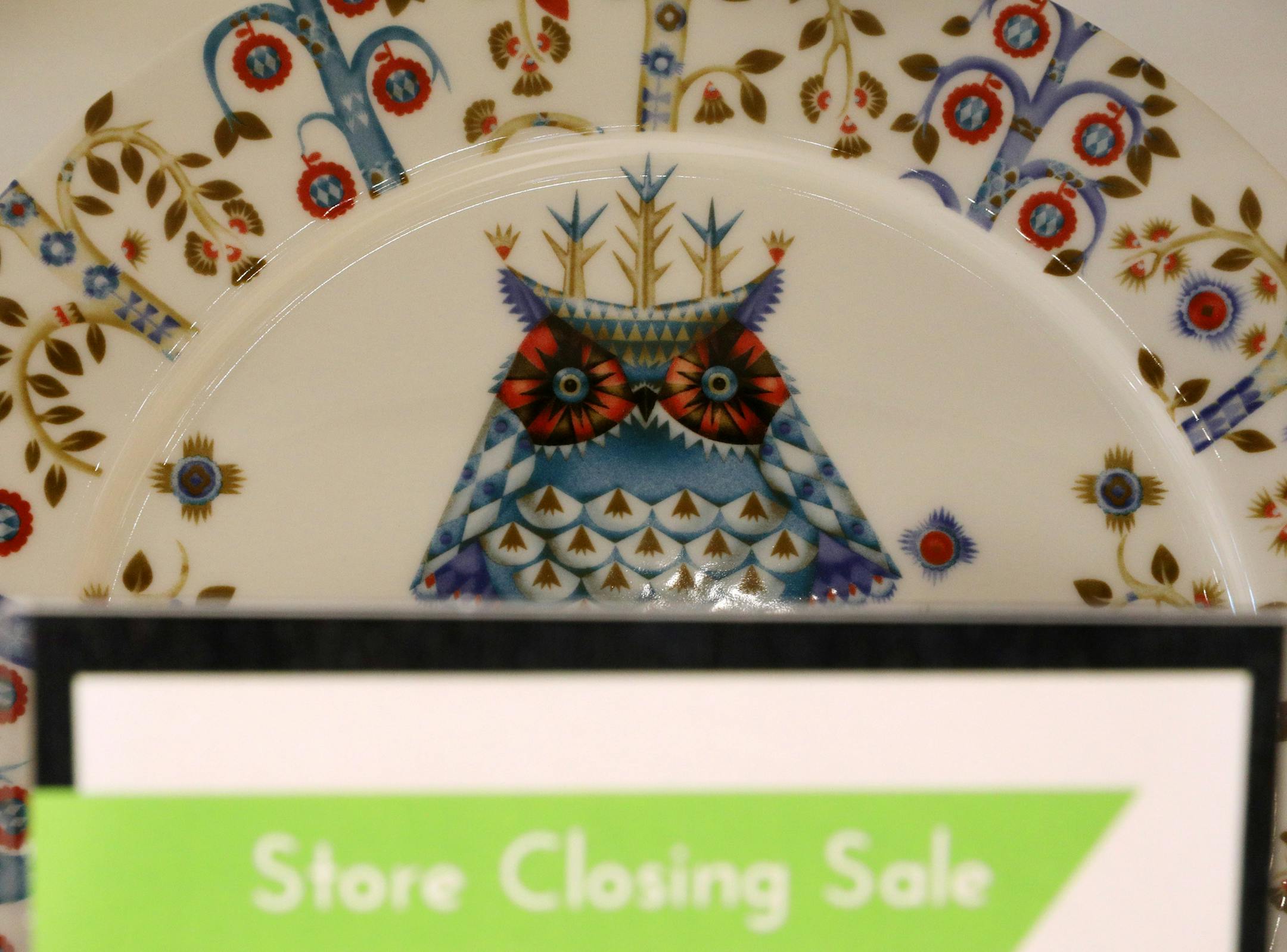 An owl peeked out from a sale sign as discounted kitchenware sat on display. ] ANTHONY SOUFFLE ï anthony.souffle@startribune.com Workers took stock of inventory and marked discounts on items Tuesday, March 21, 2017 at Always Mod in Golden Valley, Minn. Ben Horn, owner of Always Mod, formerly Finn Style, has decided to close his retail shop and go exclusively into online sales for his Scandinavian home decor.