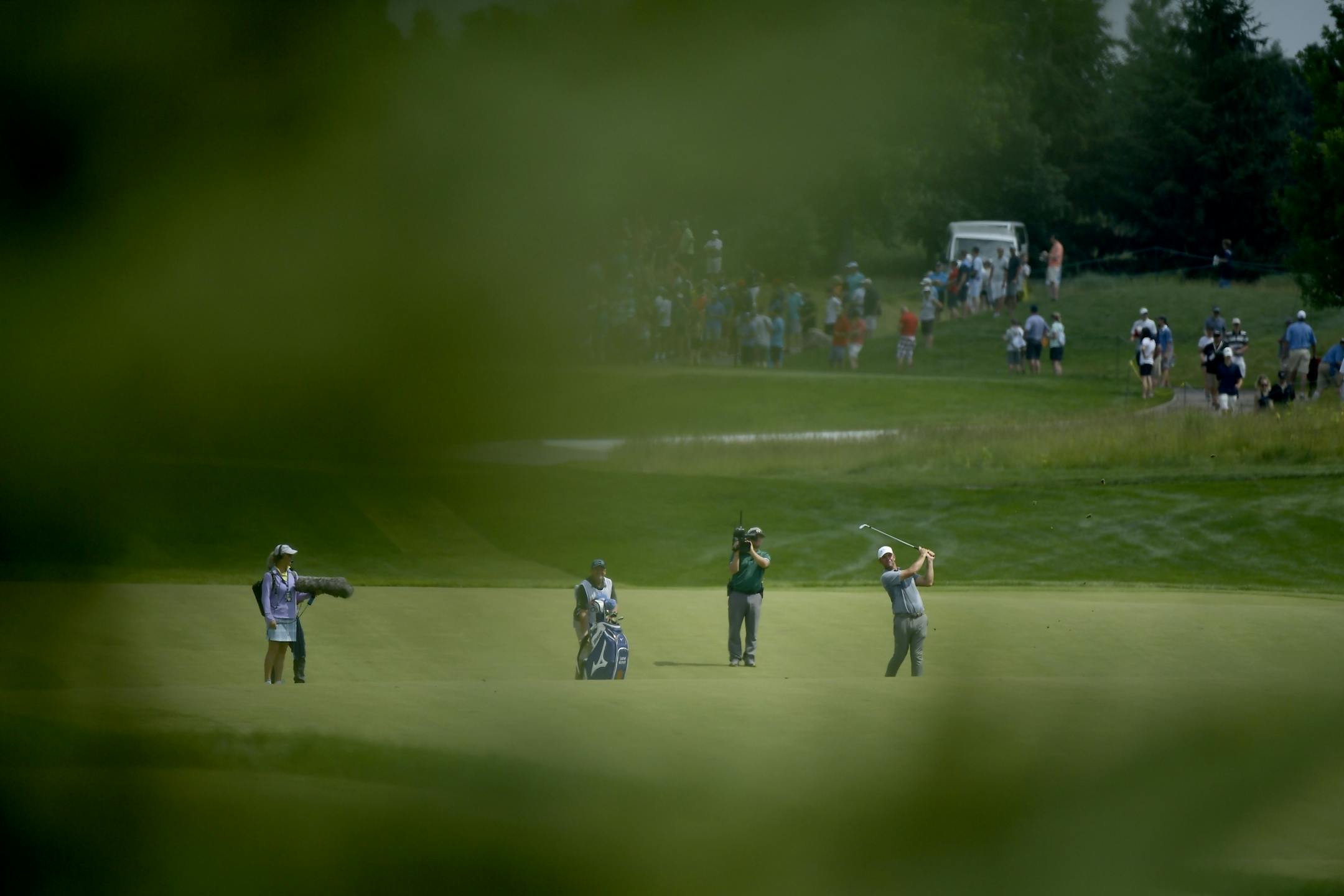 Lucas Glover hits onto the 16th green during the final day of the 3M Open at TPC Twin Cities.