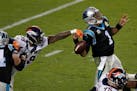 FILE - In this Feb. 7, 2016, file photo, Denver Broncos' Von Miller (58) strips the ball from Carolina Panthers' Cam Newton (1) during the second half