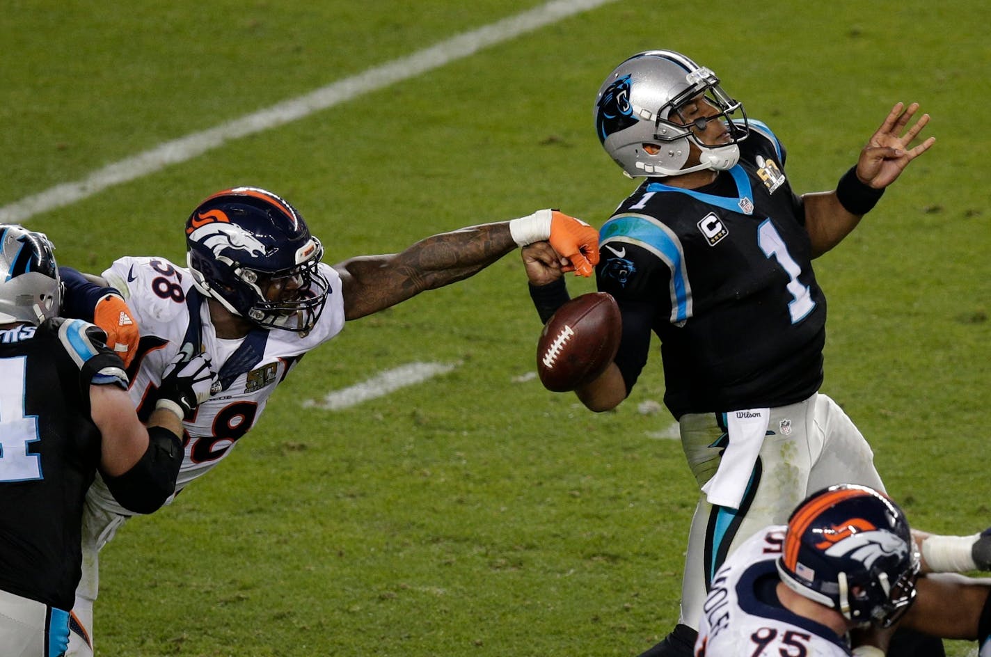 FILE - In this Feb. 7, 2016, file photo, Denver Broncos' Von Miller (58) strips the ball from Carolina Panthers' Cam Newton (1) during the second half of the NFL Super Bowl 50 football game in Santa Clara, Calif. Miller has agreed to a blockbuster $114.5 million contract with the Denver Broncos that includes $70 million in guarantees and makes him the highest-paid nonquarterback in NFL history. The Super Bowl MVP accepted the six-year offer two hours before Friday's, July 15, 2016 deadline, twee