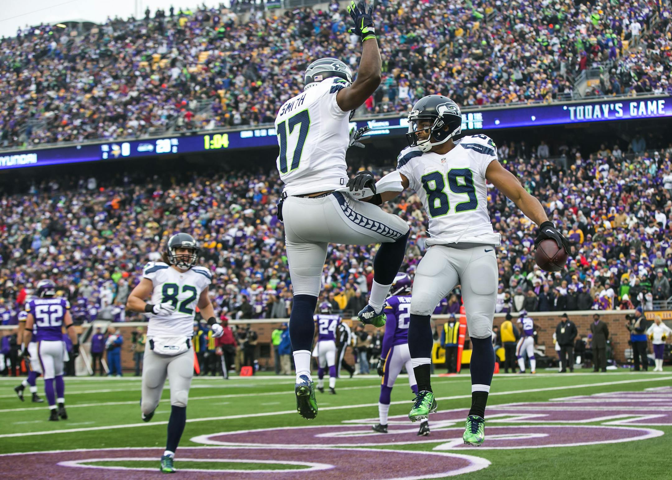 Seattle Seahawks wide receiver Kevin Smith celebrates with Seahawks wide receiver Doug Baldwin after Baldwin's second-quarter touchdown on Sunday, Dec. 6, 2015, at TCF Bank Stadium in Minneapolis. (Bettina Hansen/Seattle Times/TNS) ORG XMIT: 1177693