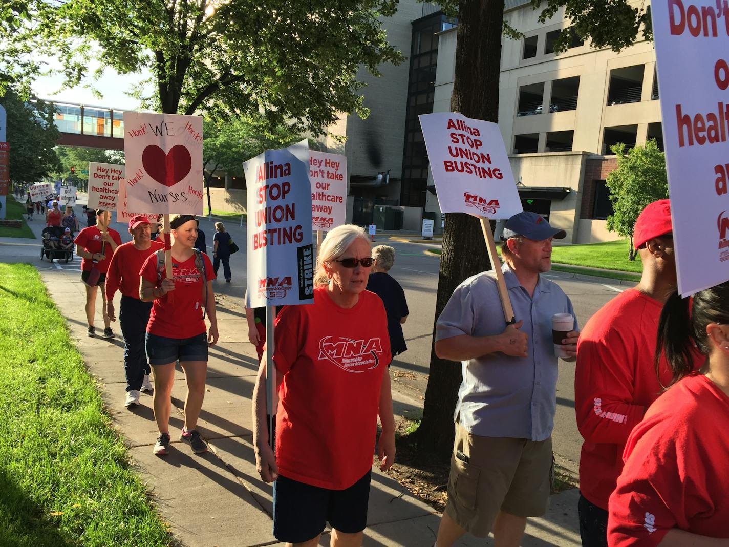 Hundreds of striking nurses set up picket lines at four Twin Cities hospitals Sunday morning as a contract dispute with Allina Health spilled onto the streets.