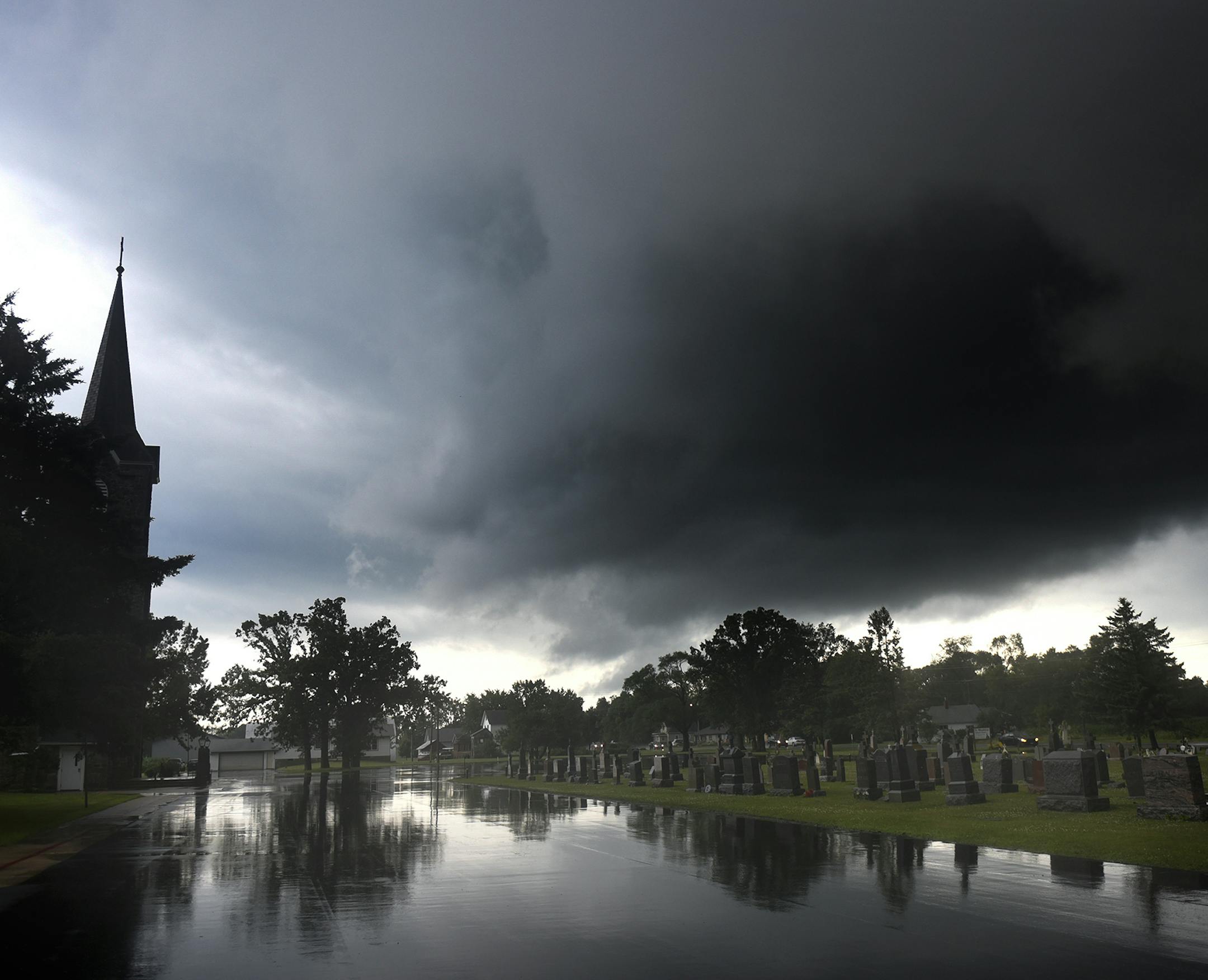Clouds cover the sky as storms pass through the area north of Luxemburg, Minn., on Monday, July 11, 2016. At least two tornadoes, torrential rain and powerful winds damaged homes, forced the evacuation of a nursing home and flooded highways in north-central Minnesota. (Dave Schwarz/St. Cloud Times via AP) ORG XMIT: MIN2016071217062380