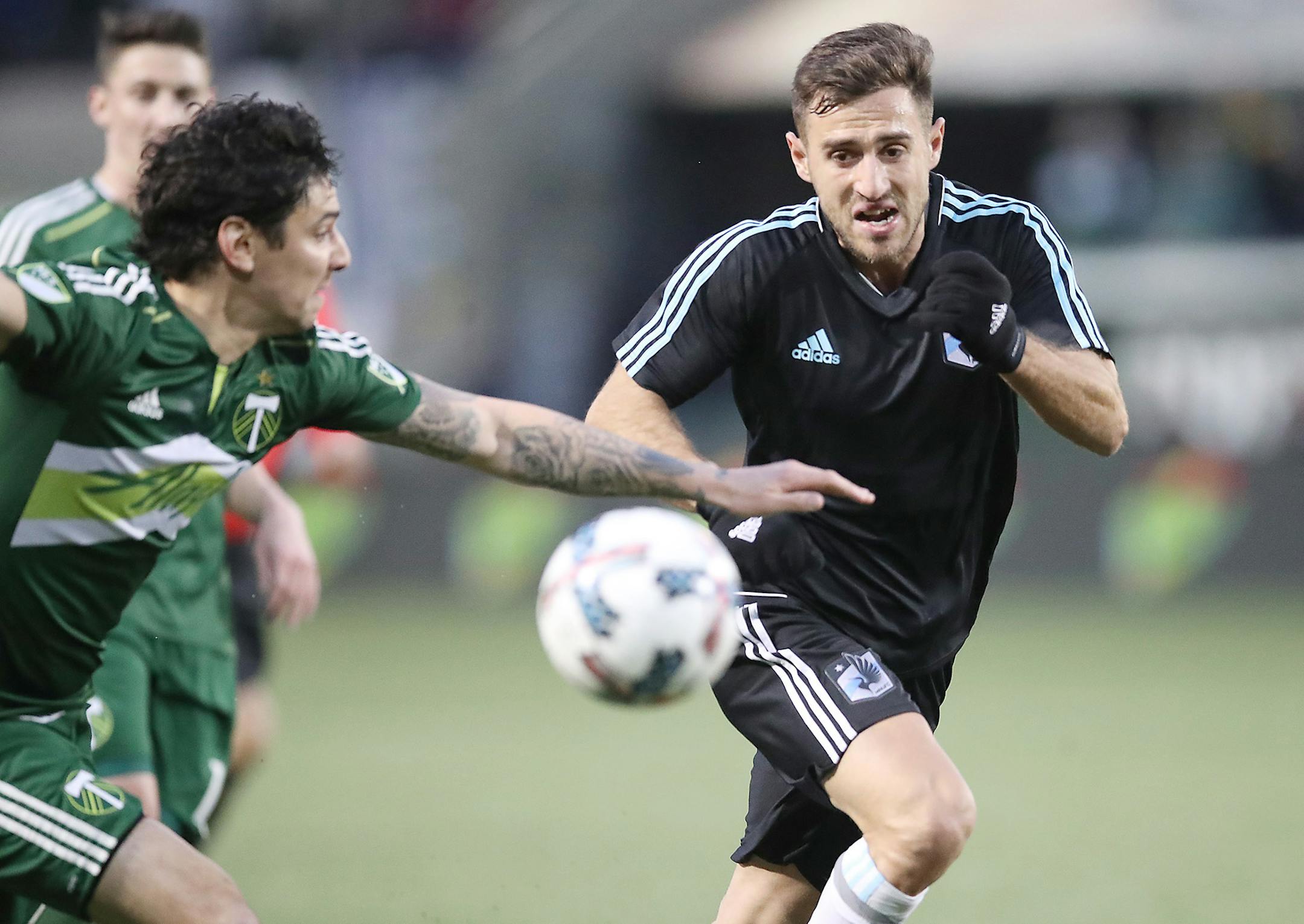 Minnesota United FC's Bashkim Kadri and Portland Timber Zarek Valentin battled for the ball in the first half against the Portland Timbers at Providence Park, Sunday, February 12, 2017 in Portland, OR. ] ELIZABETH FLORES � liz.flores@startribune.com