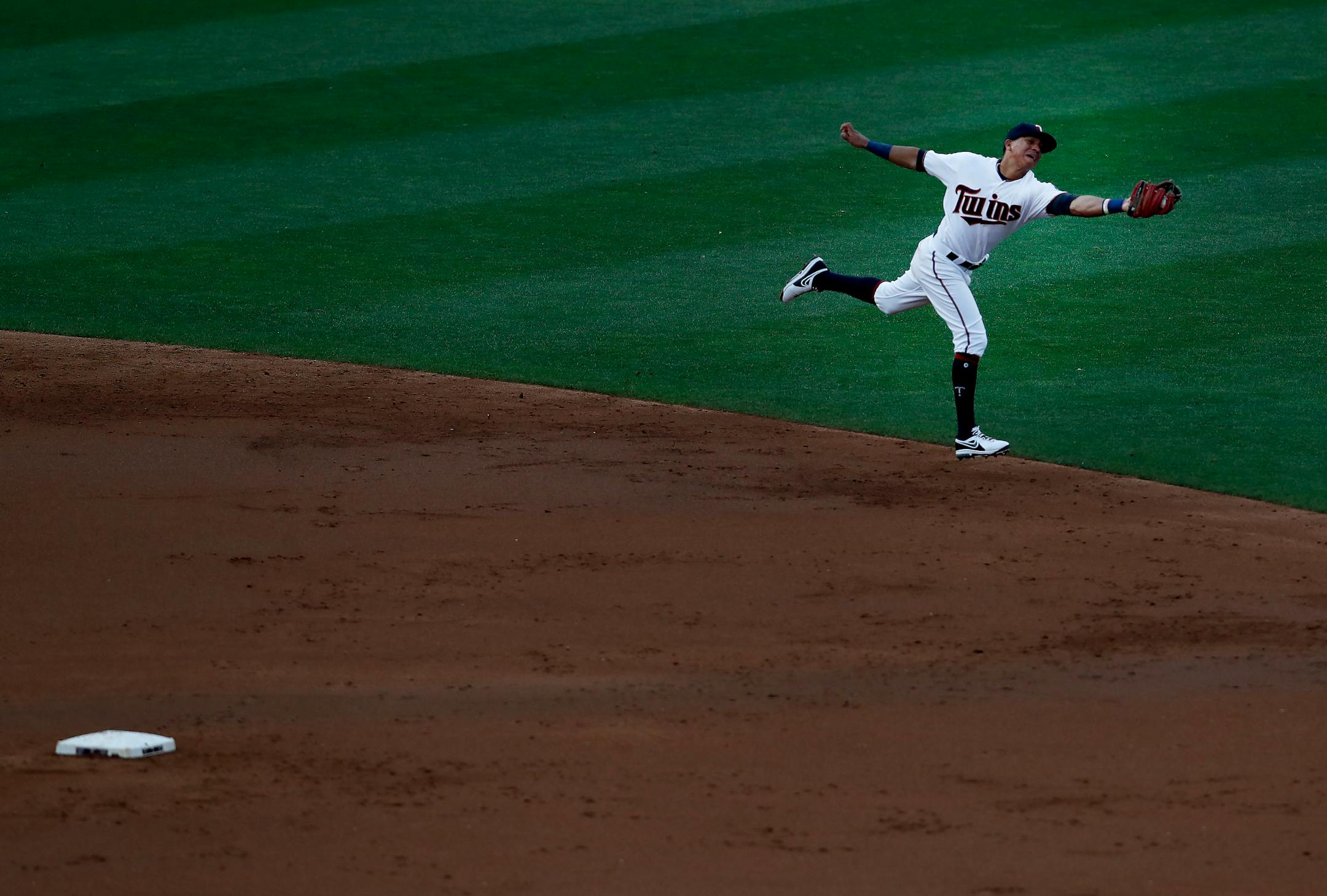 Twins shortstop Ehire Adrianza lunged to catch a soft liner hit by the Yankees' Starlin Castro for an out in the second inning. ] CARLOS GONZALEZ � cgonzalez@startribune.com - July 17, 2017, Minneapolis, MN, Target Field, MLB, Minnesota Twins vs. New York Yankees