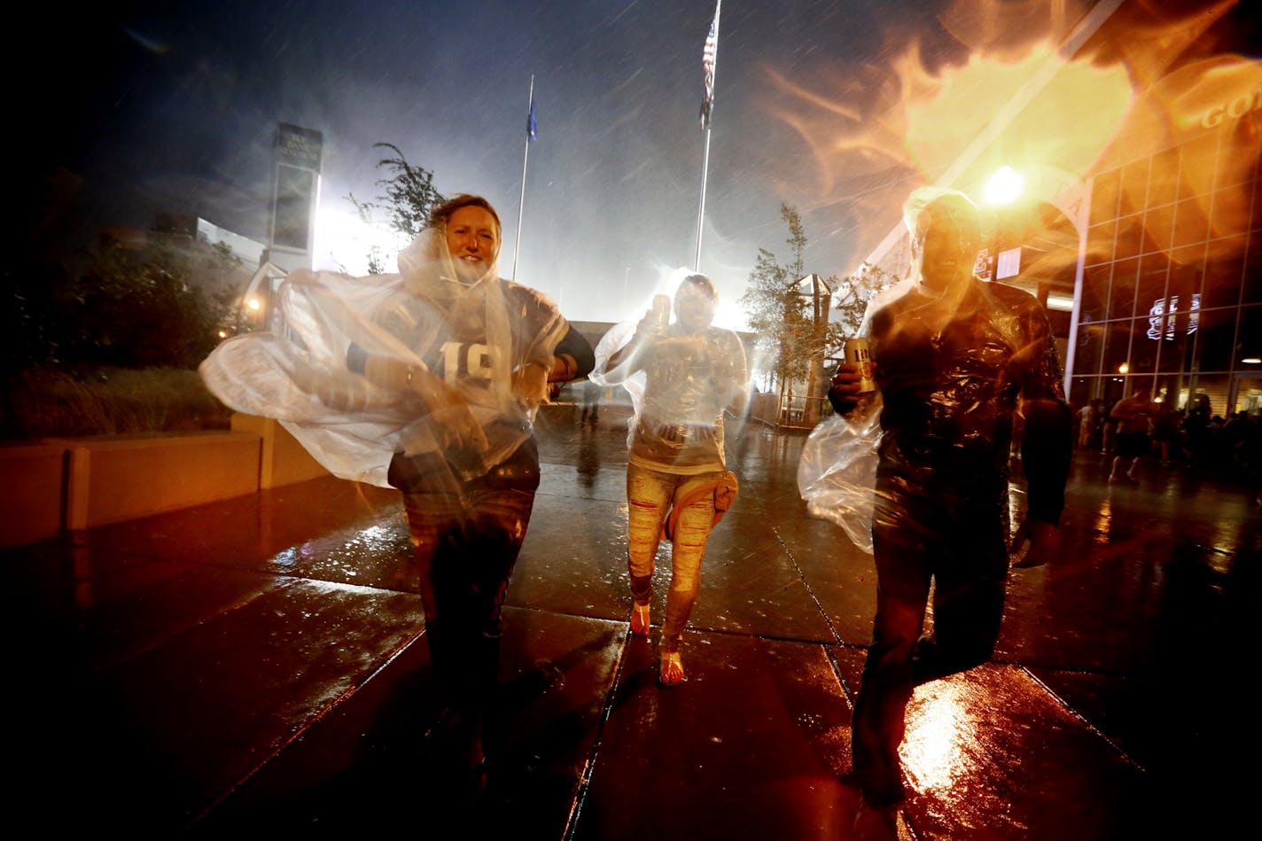 Vikings fans were evacuated in the second quarter from TCF Bank Stadium because of lighting and heavy rains during a game against the Oakland Raiders in August of 2015.
