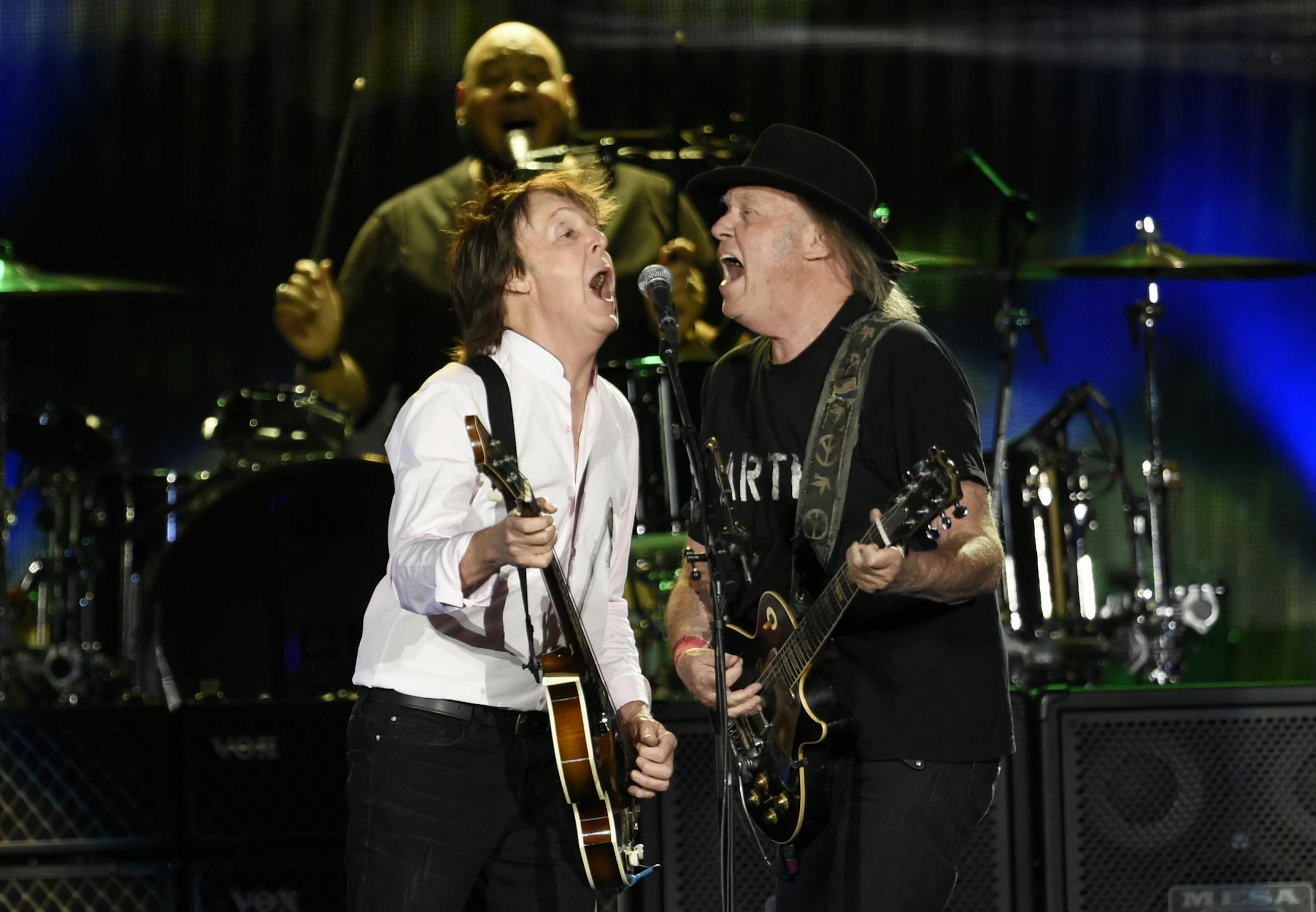 Paul McCartney, left, is joined by Neil Young during his performance on day 2 of the 2016 Desert Trip music festival at Empire Polo Field on Saturday, Oct. 8, 2016, in Indio, Calif.