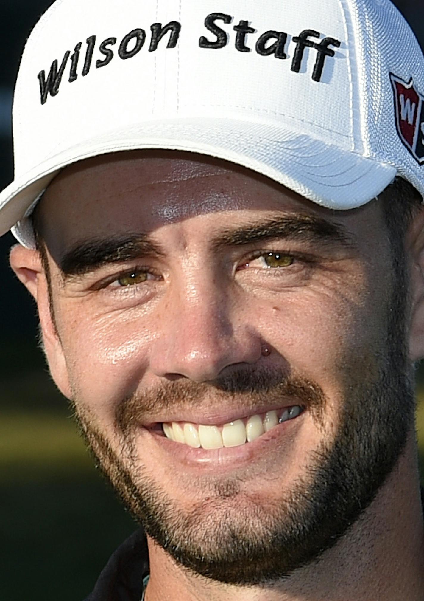 Troy Merritt poses with the trophy after he won the Quicken Loans National golf tournament at the Robert Trent Jones Golf Club in Gainesville, Va., Sunday, Aug. 2, 2015. (AP Photo/Nick Wass)