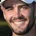 Troy Merritt poses with the trophy after he won the Quicken Loans National golf tournament at the Robert Trent Jones Golf Club in Gainesville, Va., Su