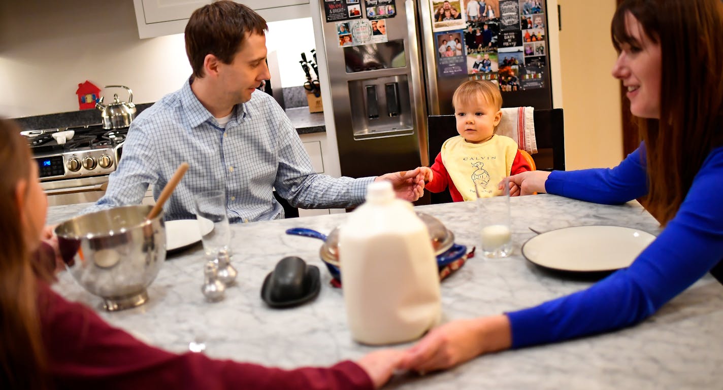 Chris and Ann Carda prayed with their two children, Alexandra and Harrison, before dinner in their home in St. Louis Park Wednesday. ] (AARON LAVINSKY/STAR TRIBUNE) aaron.lavinsky@startribune.com When Ann and Chris Carda learned that they were unable to have another child, an angel descended upon their church to help them. A fellow parishioner offered to carry the couple&#x2019;s baby, in an act the surrogate mother called one of friendship and faith. But under recommendations of a legislative t