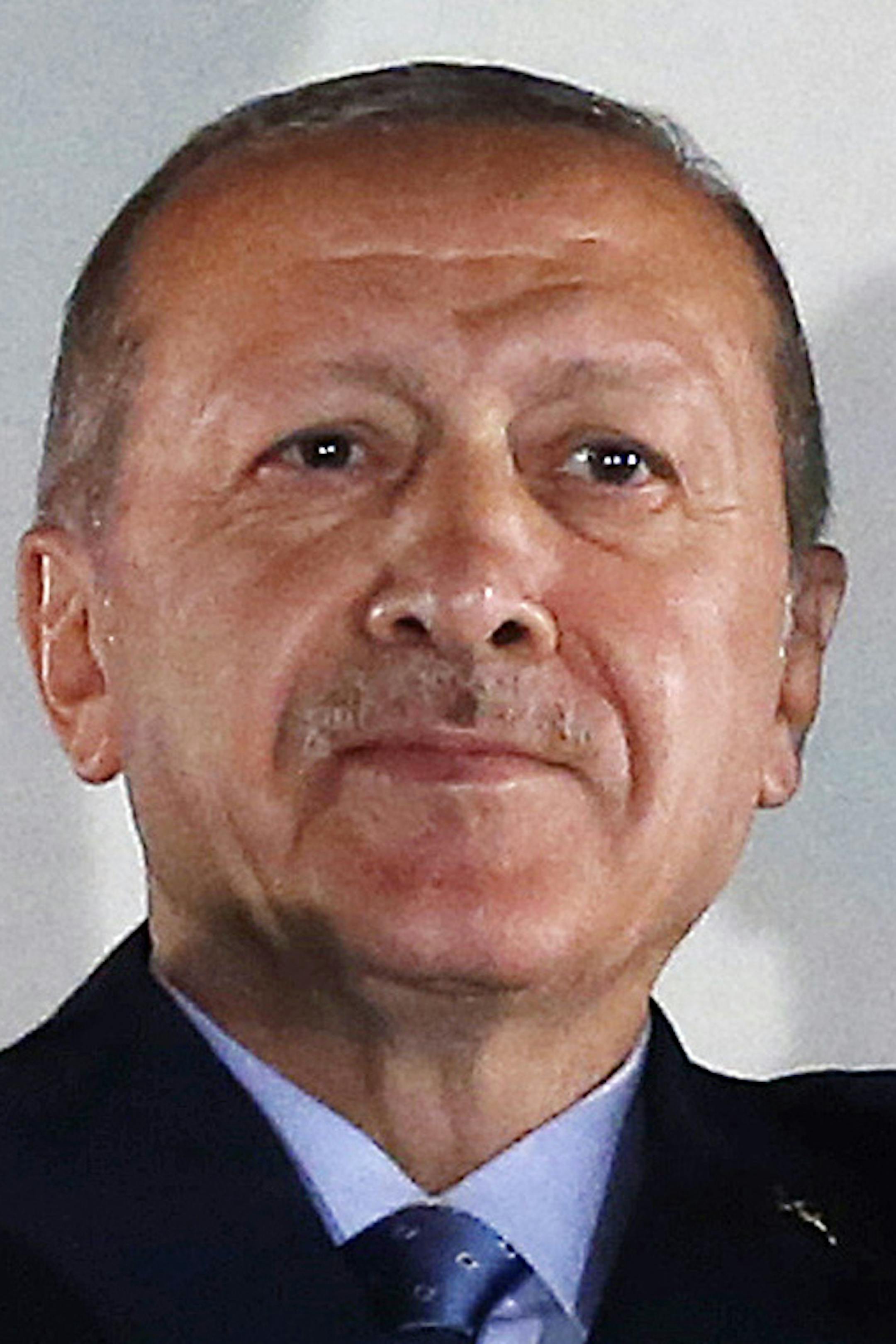 Turkey's President Recep Tayyip Erdogan, waves to supporters of his ruling Justice and Development Party (AKP) in Ankara, Turkey, early Monday, June 25, 2018. Erdogan won Turkey's landmark election Sunday, the country's electoral commission said, ushering in a new system granting the president sweeping new powers which critics say will cement what they call a one-man rule (Presidency Press Service via AP, Pool)