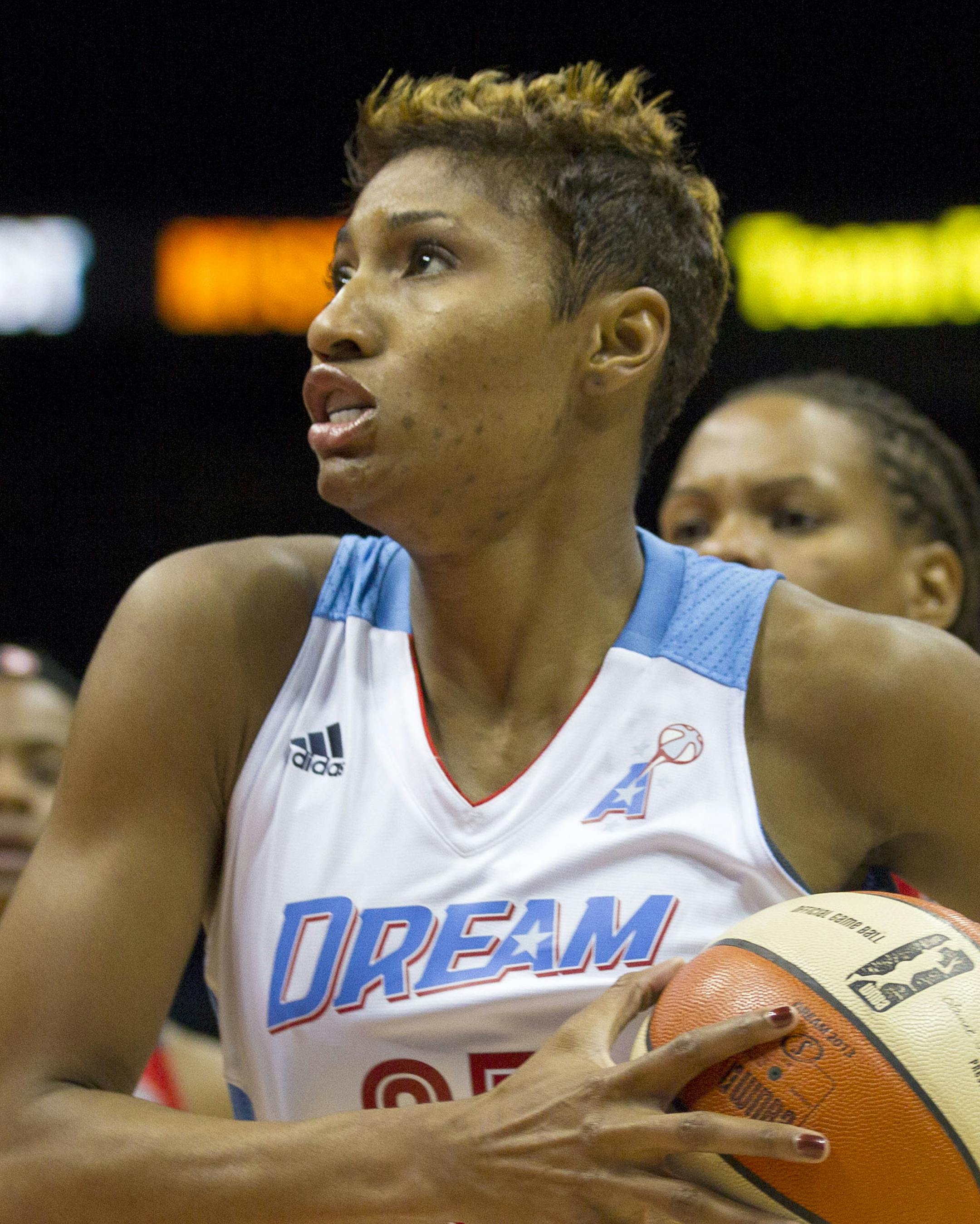 Atlanta Dream guard Angel McCoughtry (35) drives to the basket to score in the first quarter against the Washington Mystics in Game 3 of a&#x2020;WNBA basketball Eastern Conference semifinal series, Monday, Sept. 23, 2013, in Atlanta. (AP Photo/Todd Kirkland) ORG XMIT: MIN2013100420522296