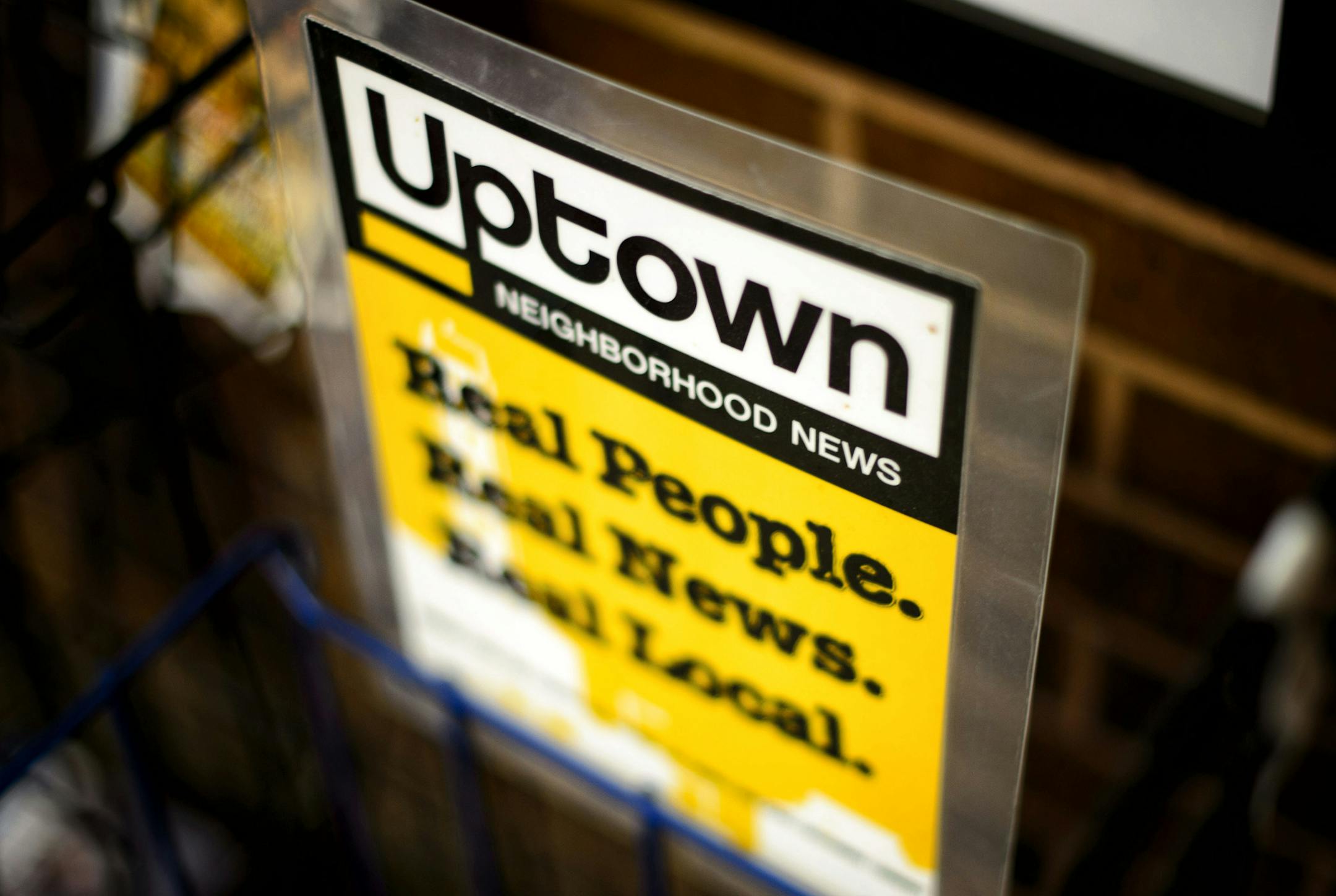An empty Uptown Neighborhood News rack in Uptown. ] GLEN STUBBE * gstubbe@startribune.com Thursday, June 4, 2015